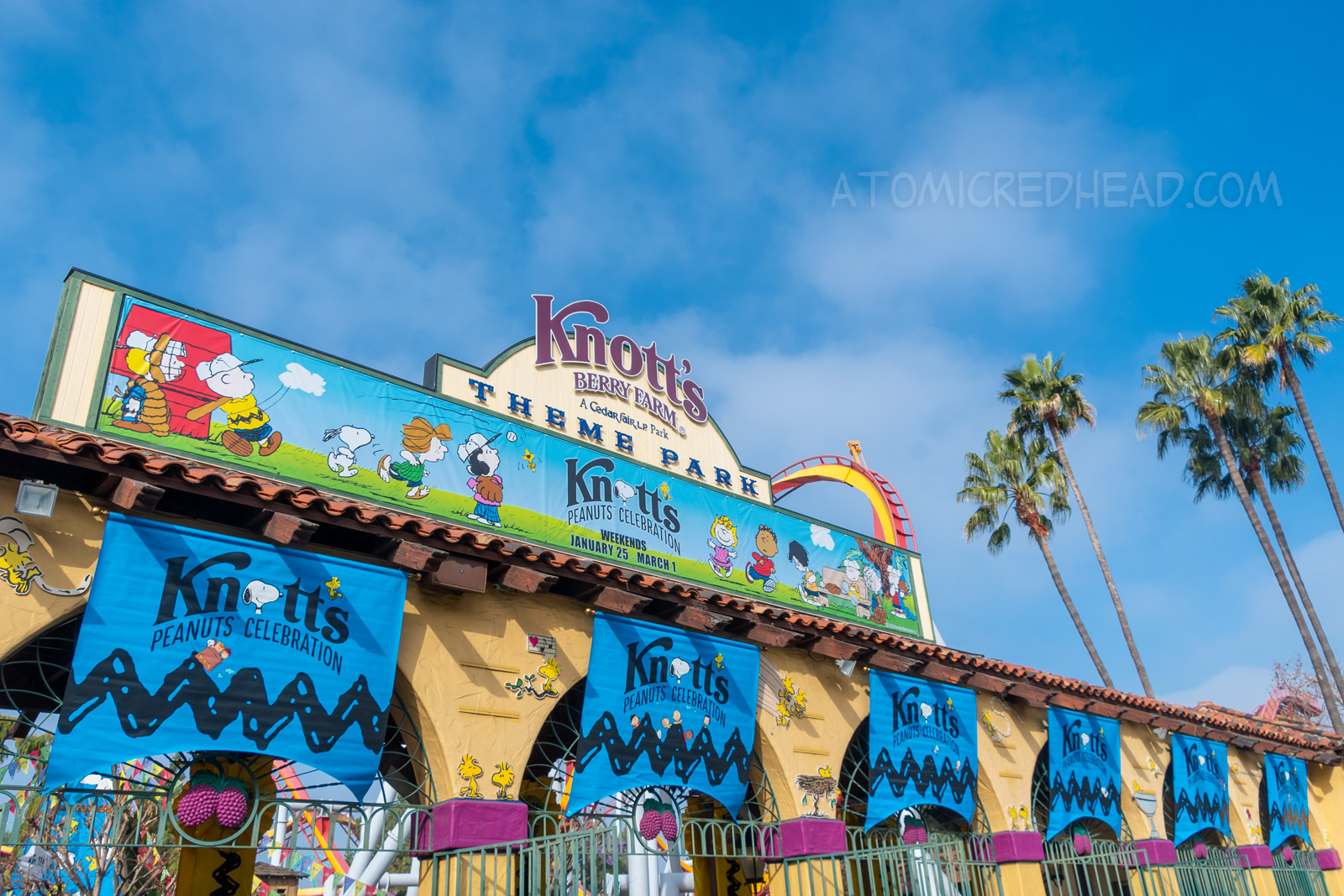 Banner above the gates to Knott's reading 'Peanuts Celebration'