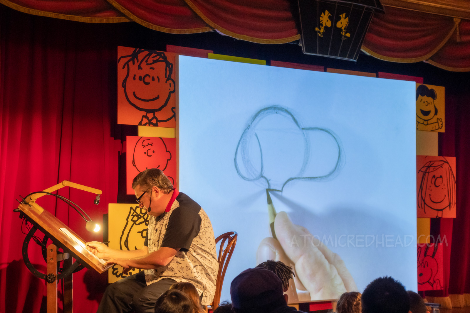 Noel, the art teacher at Peanuts Sketch School shows how to draw Snoopy.