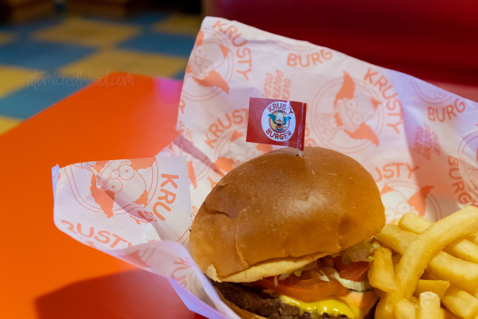 A good ol' fashioned Krusty Burger, complete with small toothpick flag featuring Krusty.