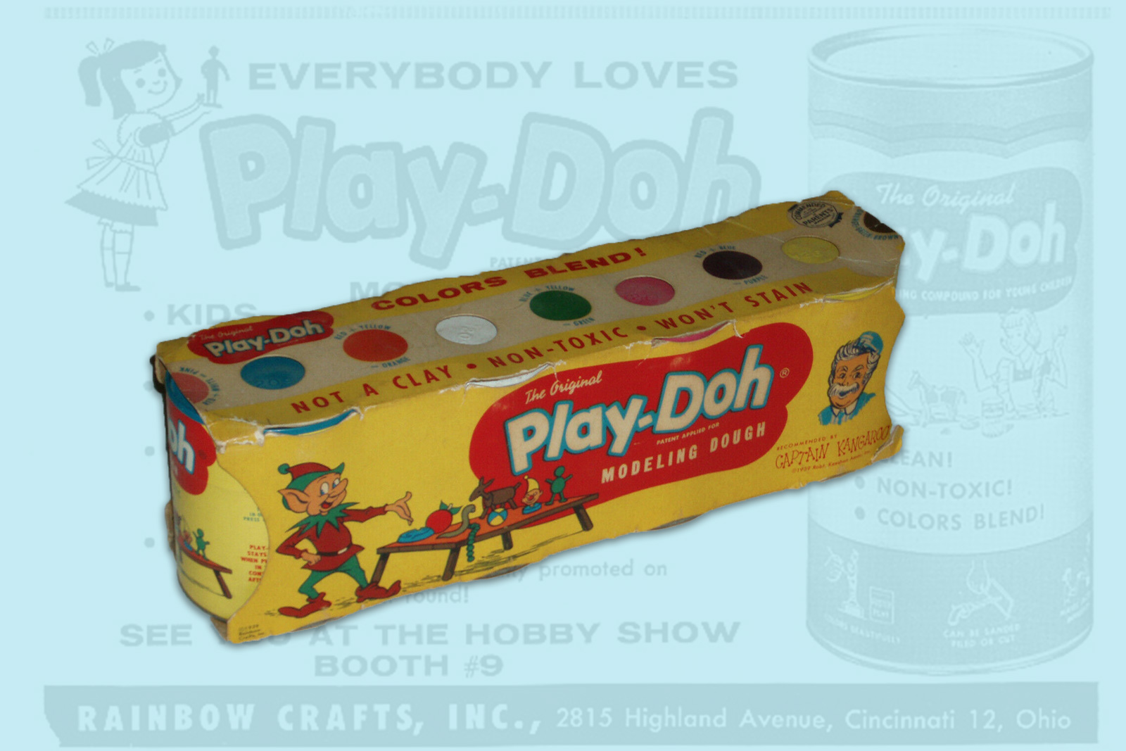 A teal background features a Play-Doh ad, vibrant in the center is a colorful pack of Play-Doh.