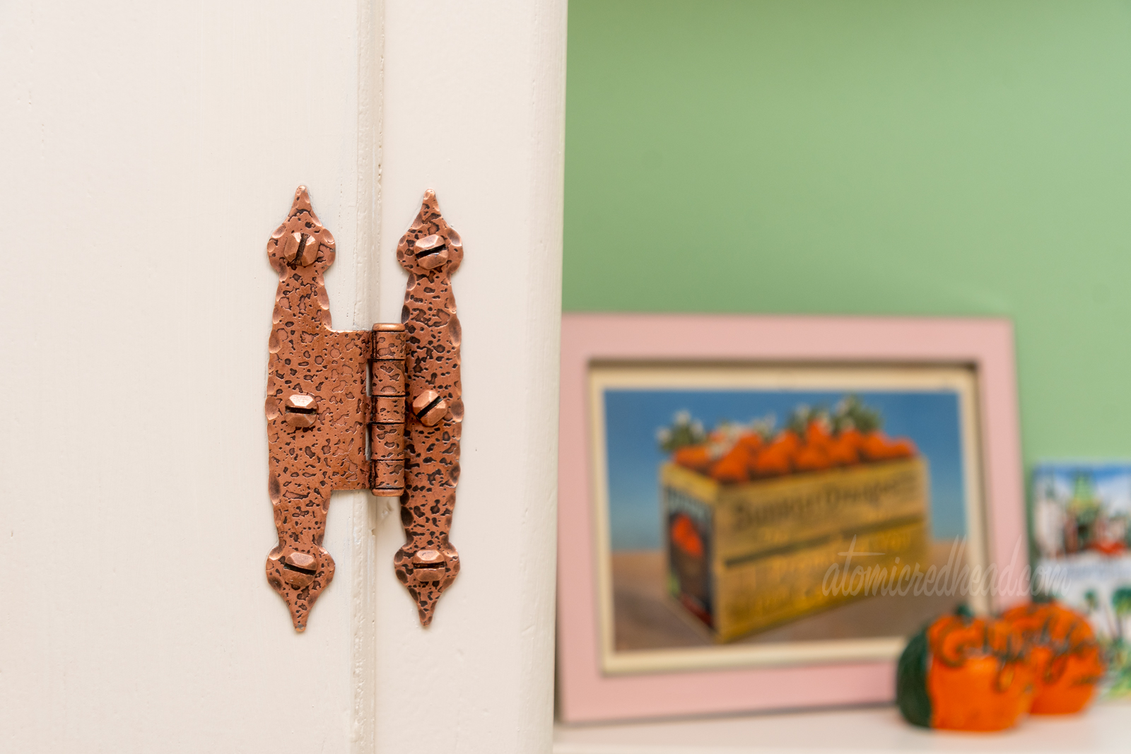 Close-up of our hinges, now free of paint, shining in warm copper.