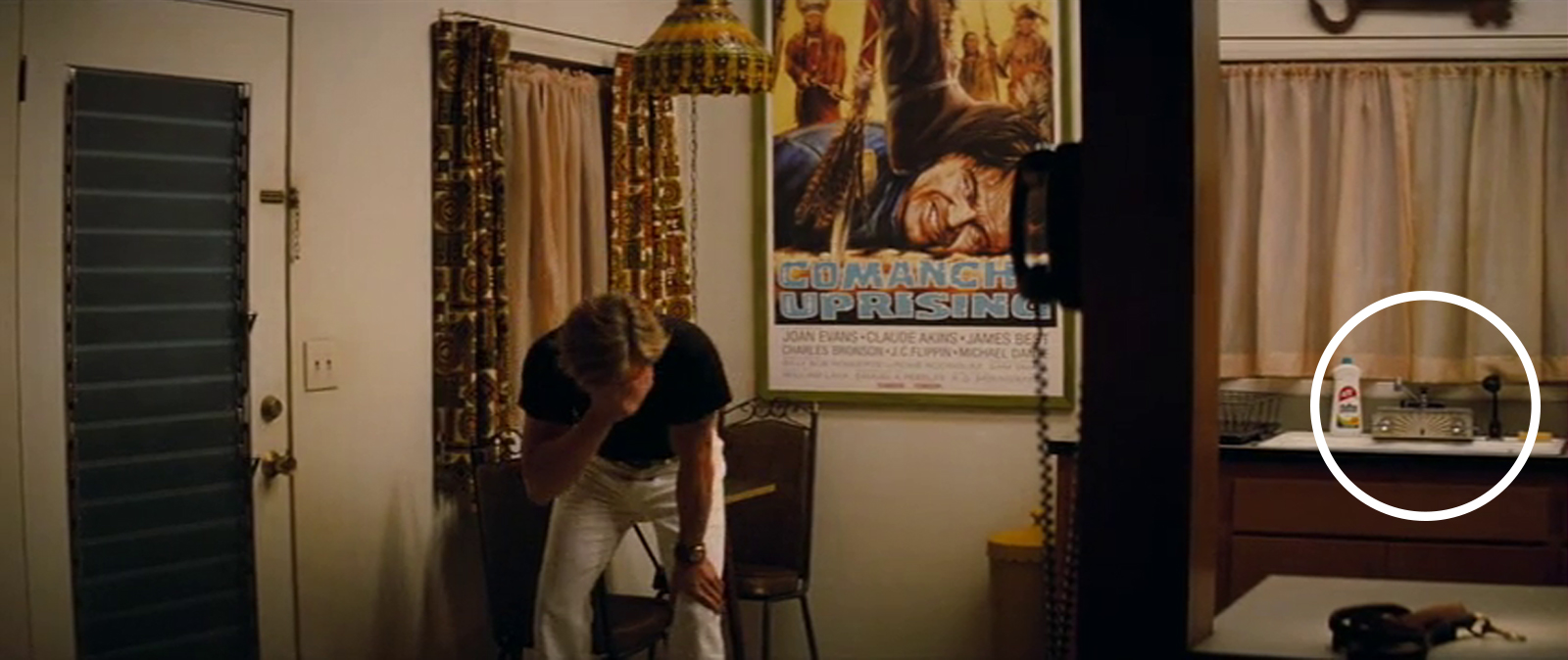 Rick's stunt double, Cliff, shields his eyes from the light he just turned on. The sink like ours sits to the right on screen.