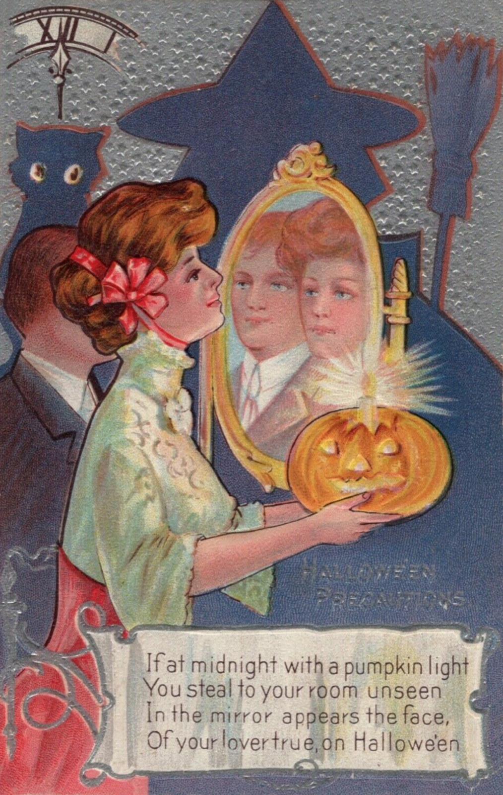 A woman in a red and white outfit holds a Jack O'lantern with a candle at the top in front of a mirror. A man stands next to her and appears in the mirror next to her. Text reads "Halloween Precautions If at midnight with a pumpkin light You steal to your room unseen In the mirror appears the face, Of your lover true, on Halloween."