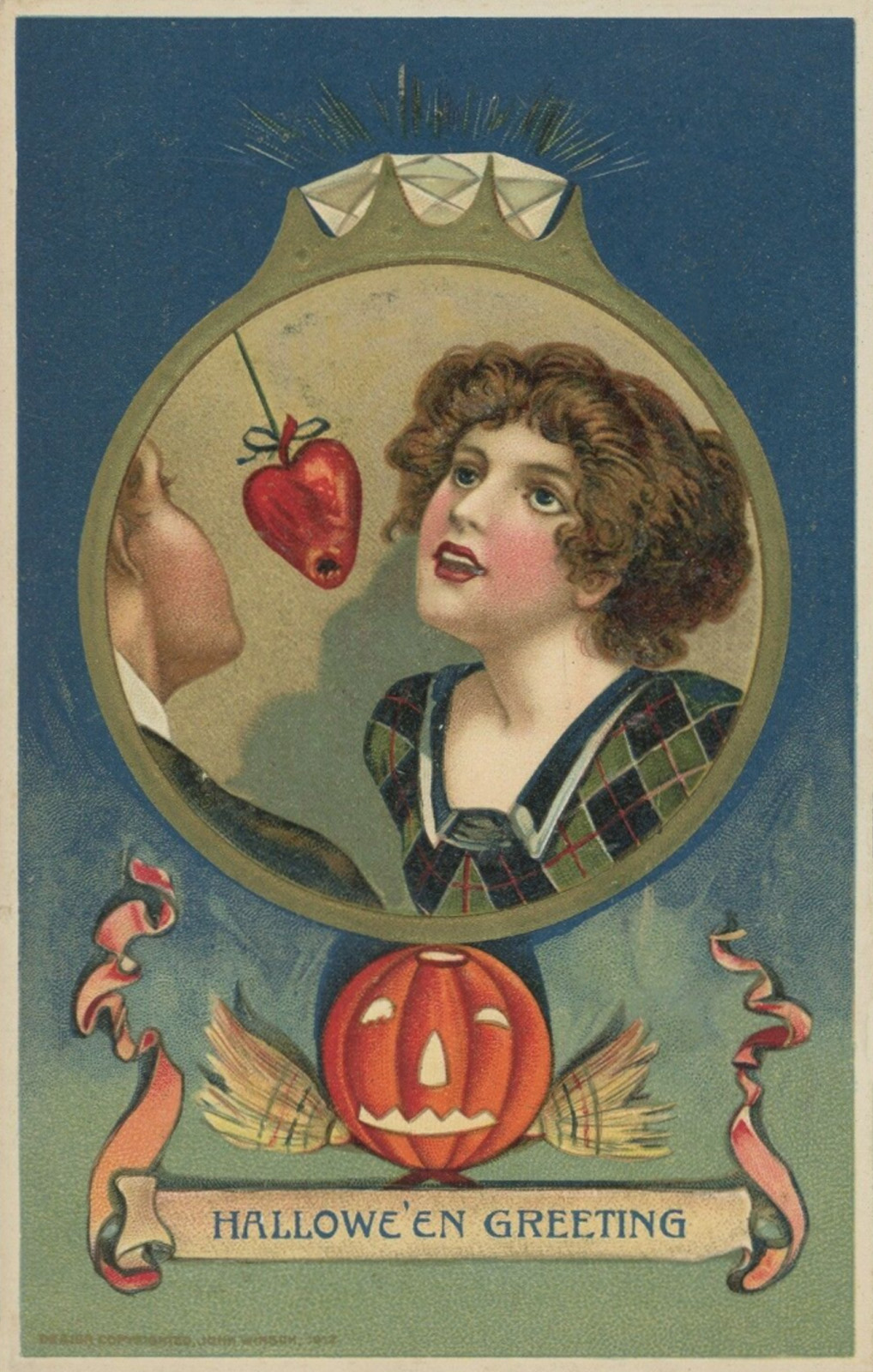 Inside the circle of a diamond ring is a woman attempting to bite into an apple shaped like a heart. Text at the bottom reads "Halloween Greeting"