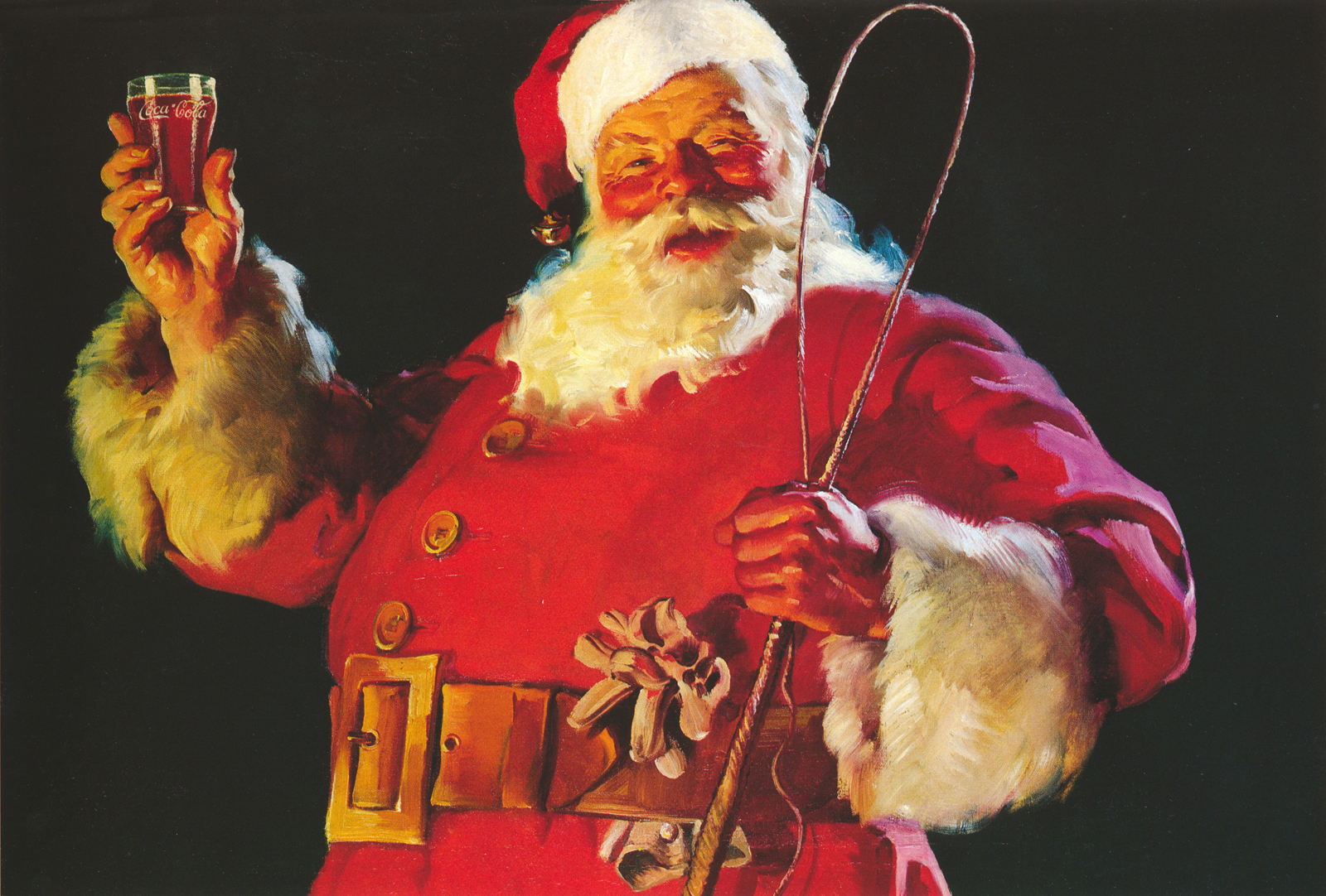 Santa in his red suit, with his cap on his head, holds a glass of Coke in one hand and a whip in the other.