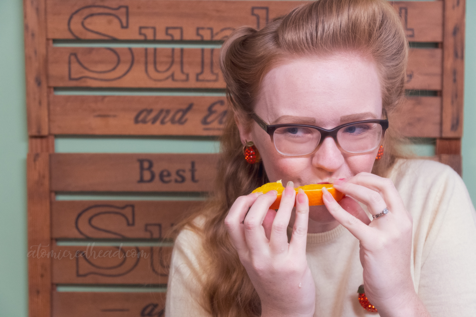Myself taking a bite out of an orange.