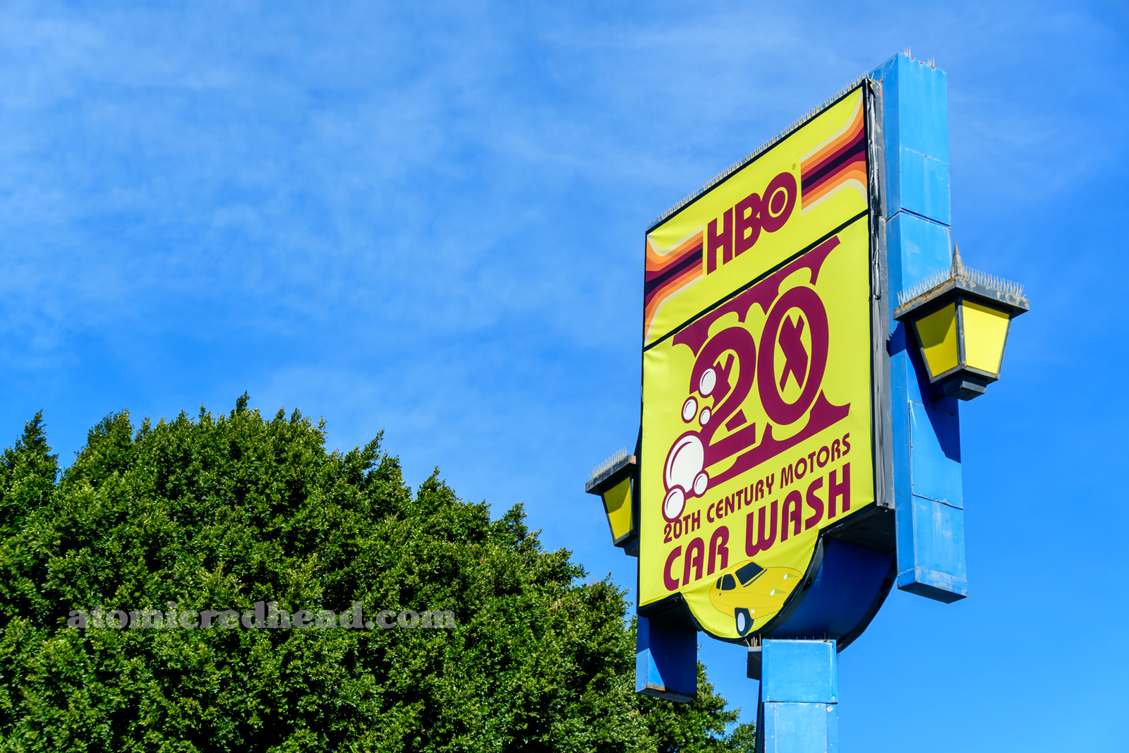 Sign for the car wash reading "HBO 20th Century Motors Car Wash."