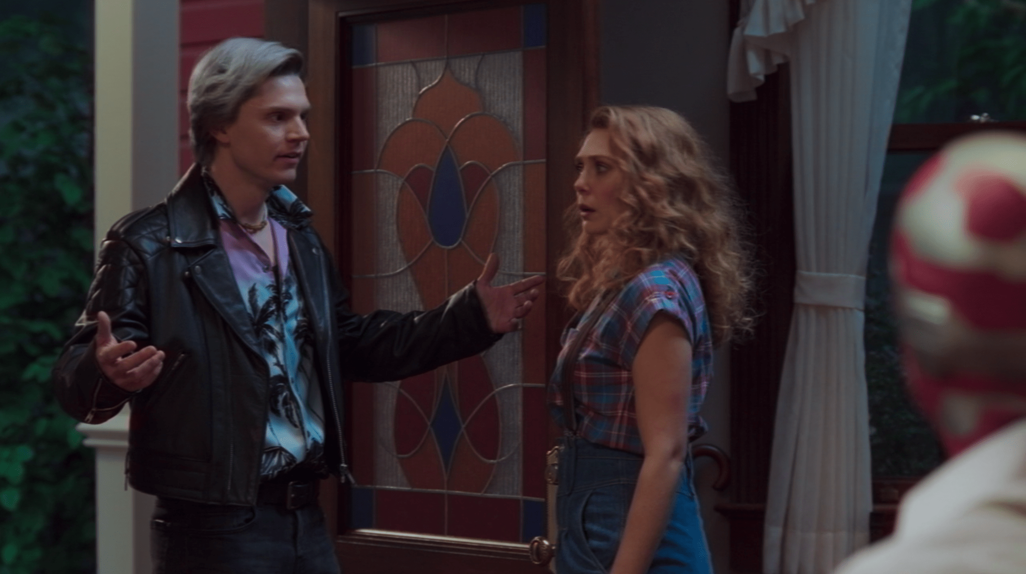 Pietro, played by Evan Peters, arrives on Wanda and Vision's doorstep, wearing a black leather motorcycle jacket, purple and teal Hawaiian shirt, and black jeans.