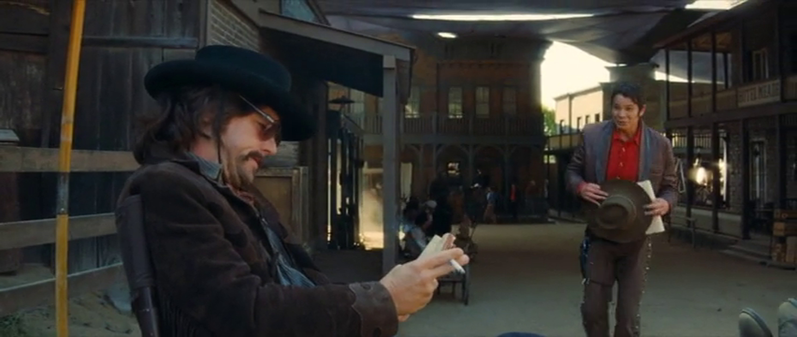 Six Points as it appears in Once Upon a Time in Hollywood. Leonardo DiCaprio sits in a chair dresses as a cowboy on the left, a western town resides just past him.