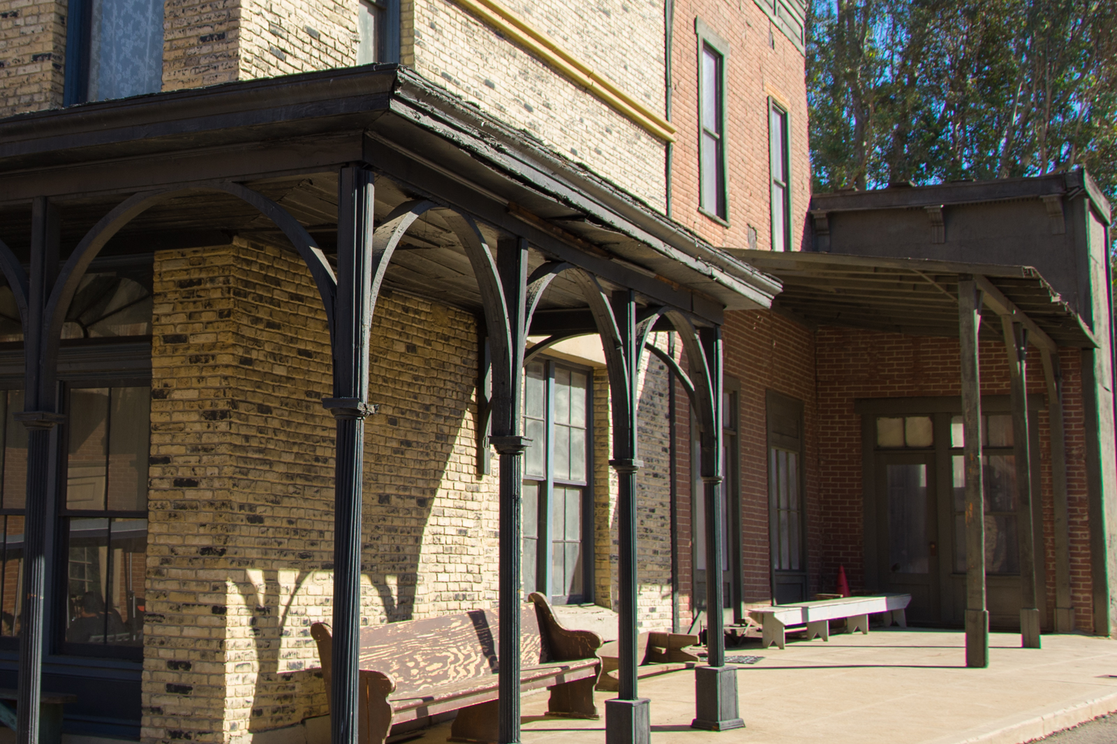 The corner of a pale brick building.
