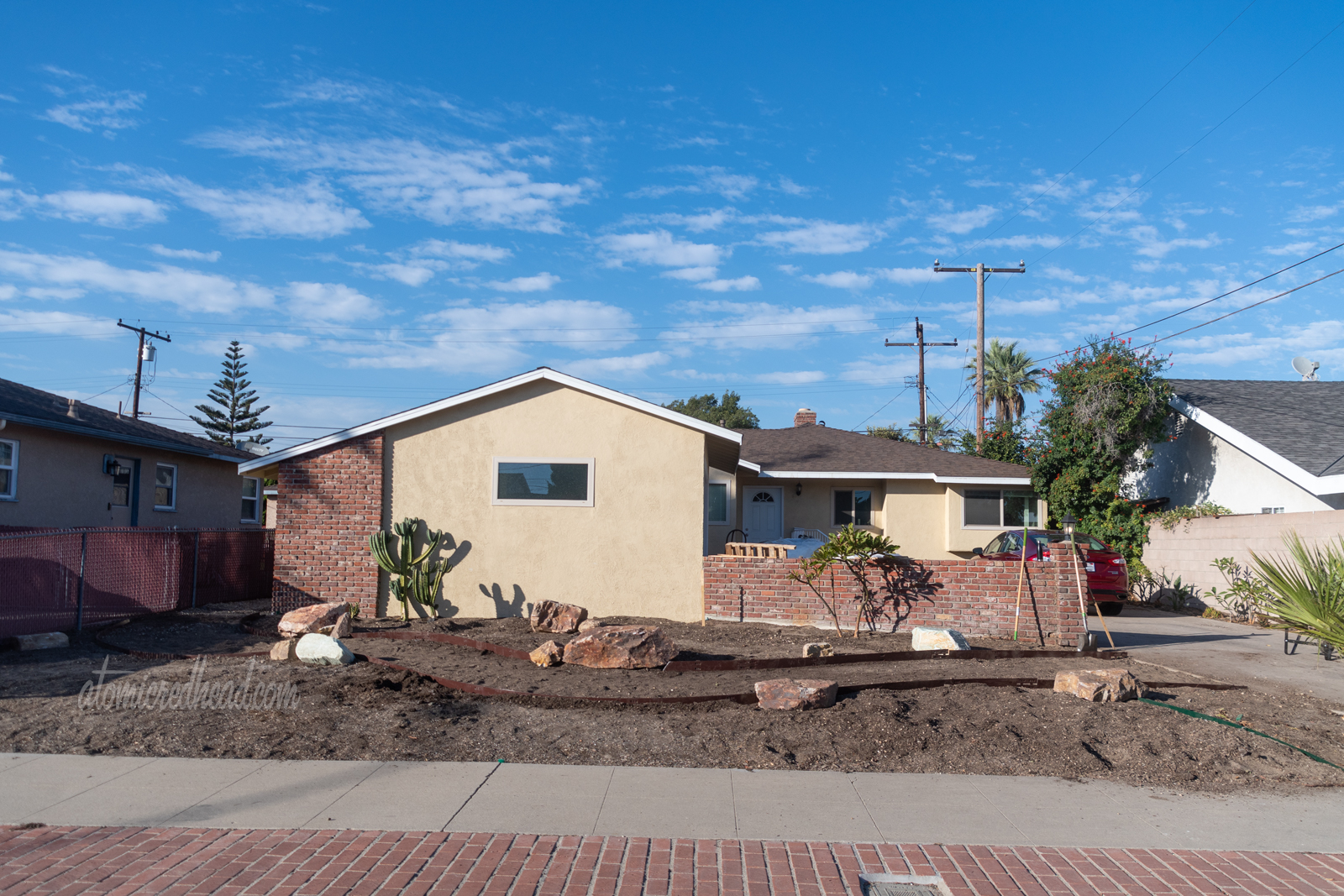Our yard in progress. Rocks placed, and edging placed for the pathway.