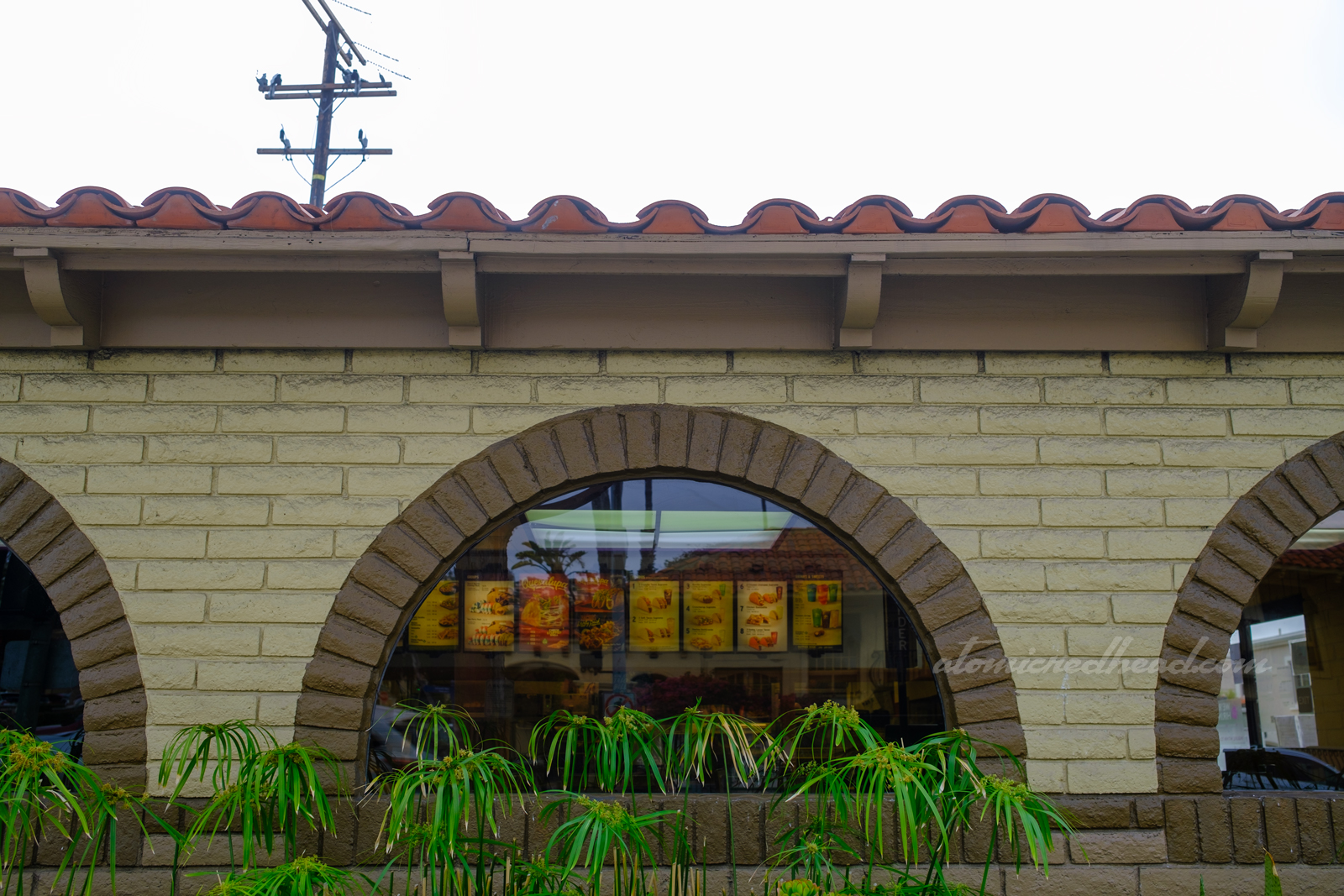 Close-up of the arched window in front.