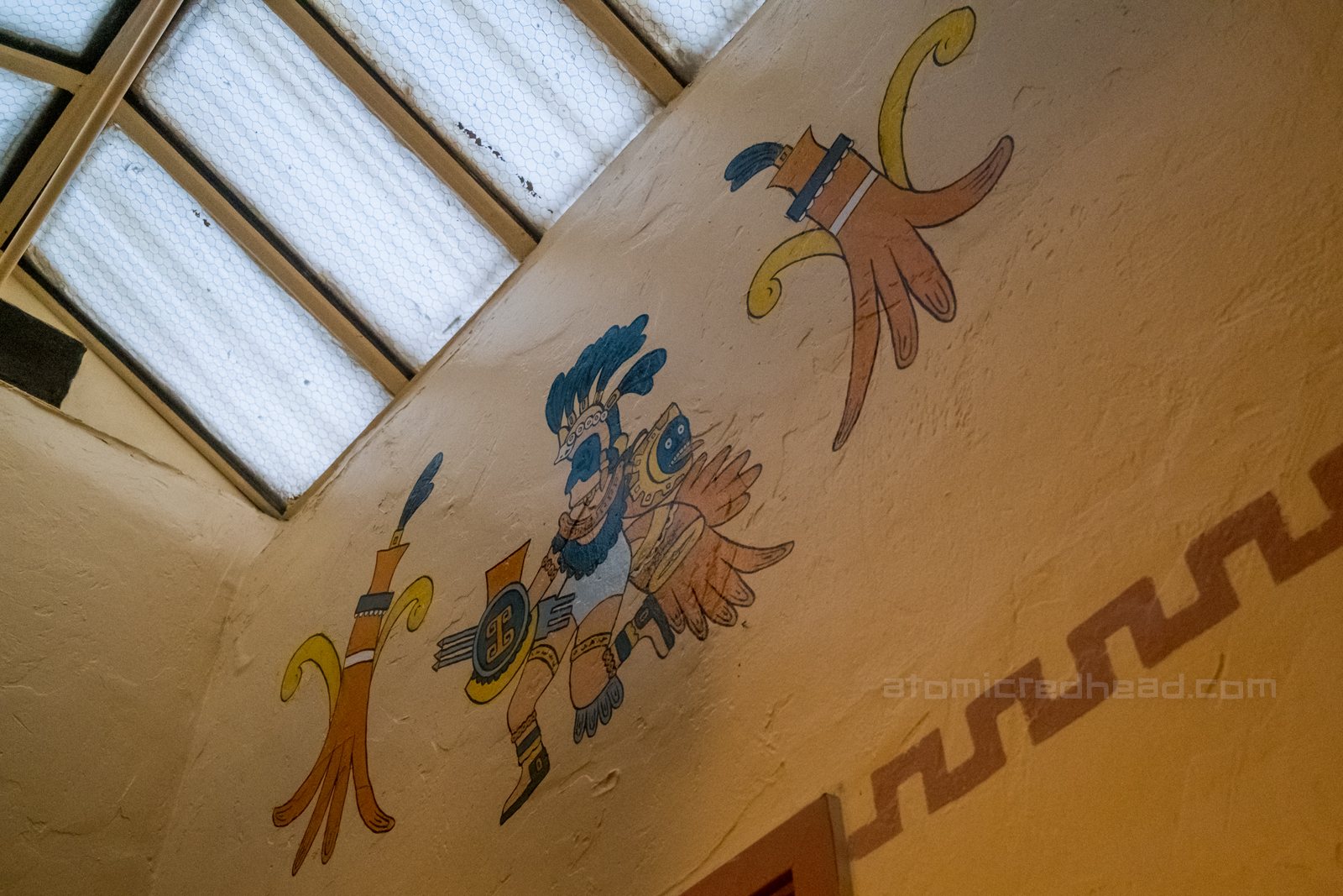 Mural of an ancient god painted on the wall.