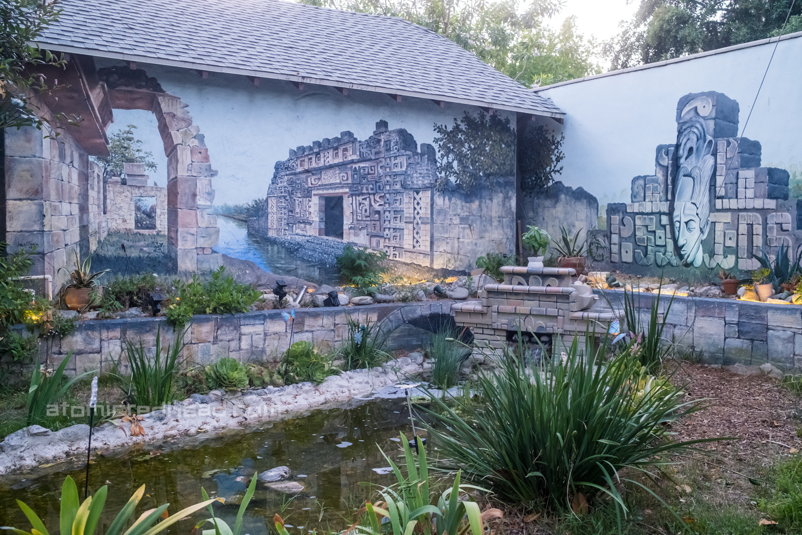 Mural of Mayan and Aztec ruins painted on the outside courtyard.