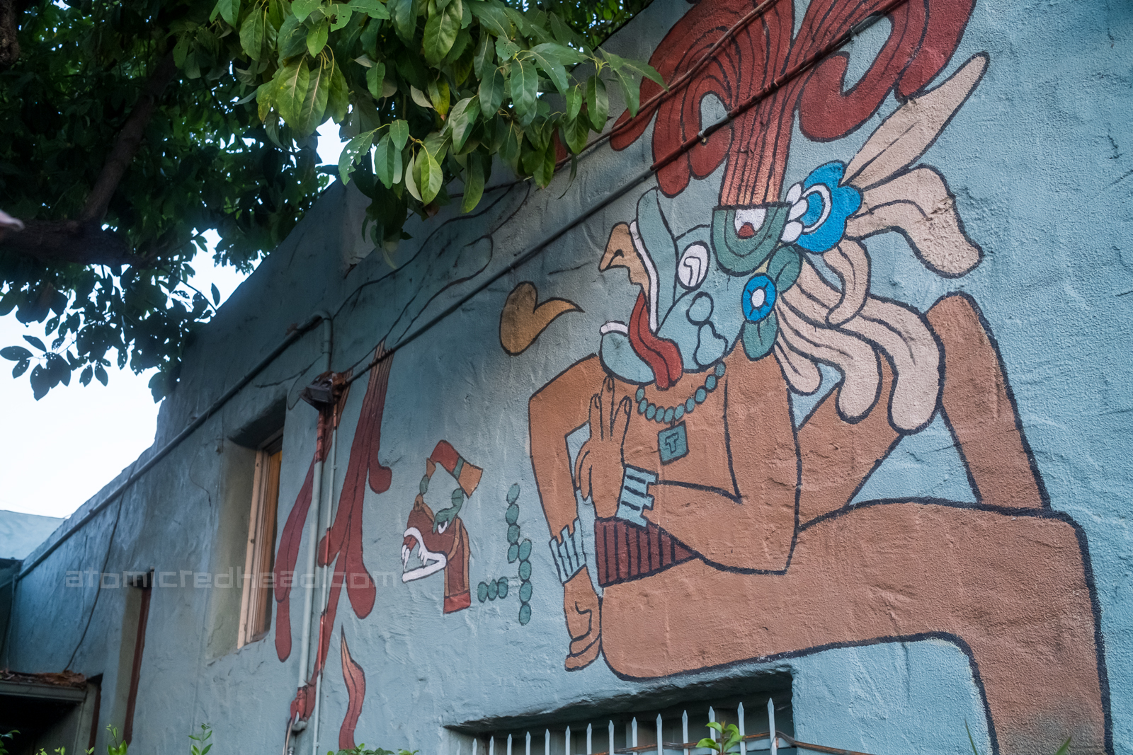 A colorful god painted on the walls of the courtyard.