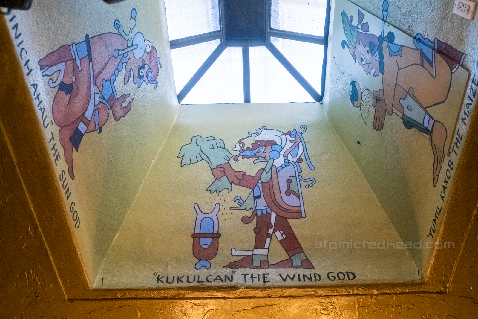 Various gods painted near a skylight.