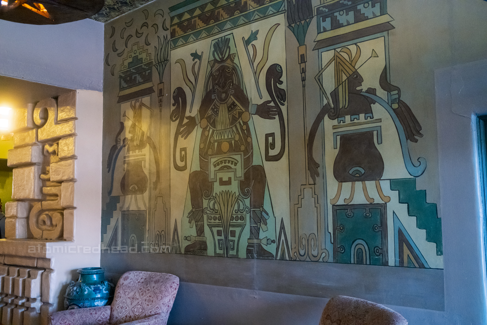 Mural of the god of death painted just inside the doors to the Aztec.