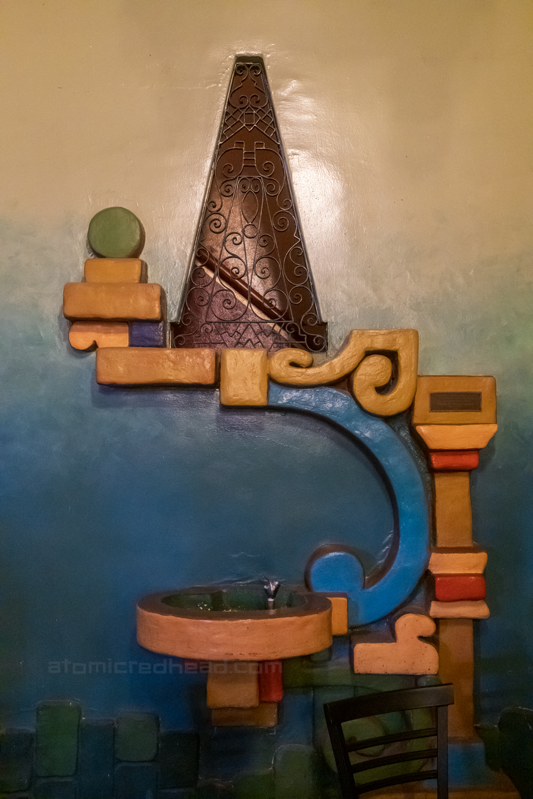 Close-up of the asymmetrical Mayan inspired drinking fountain.