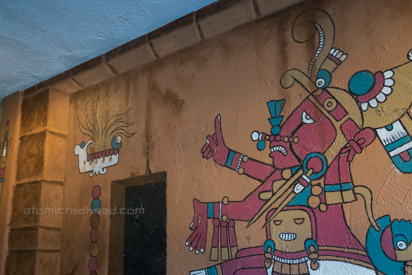 Mural of an ancient god painted in the restuarant.
