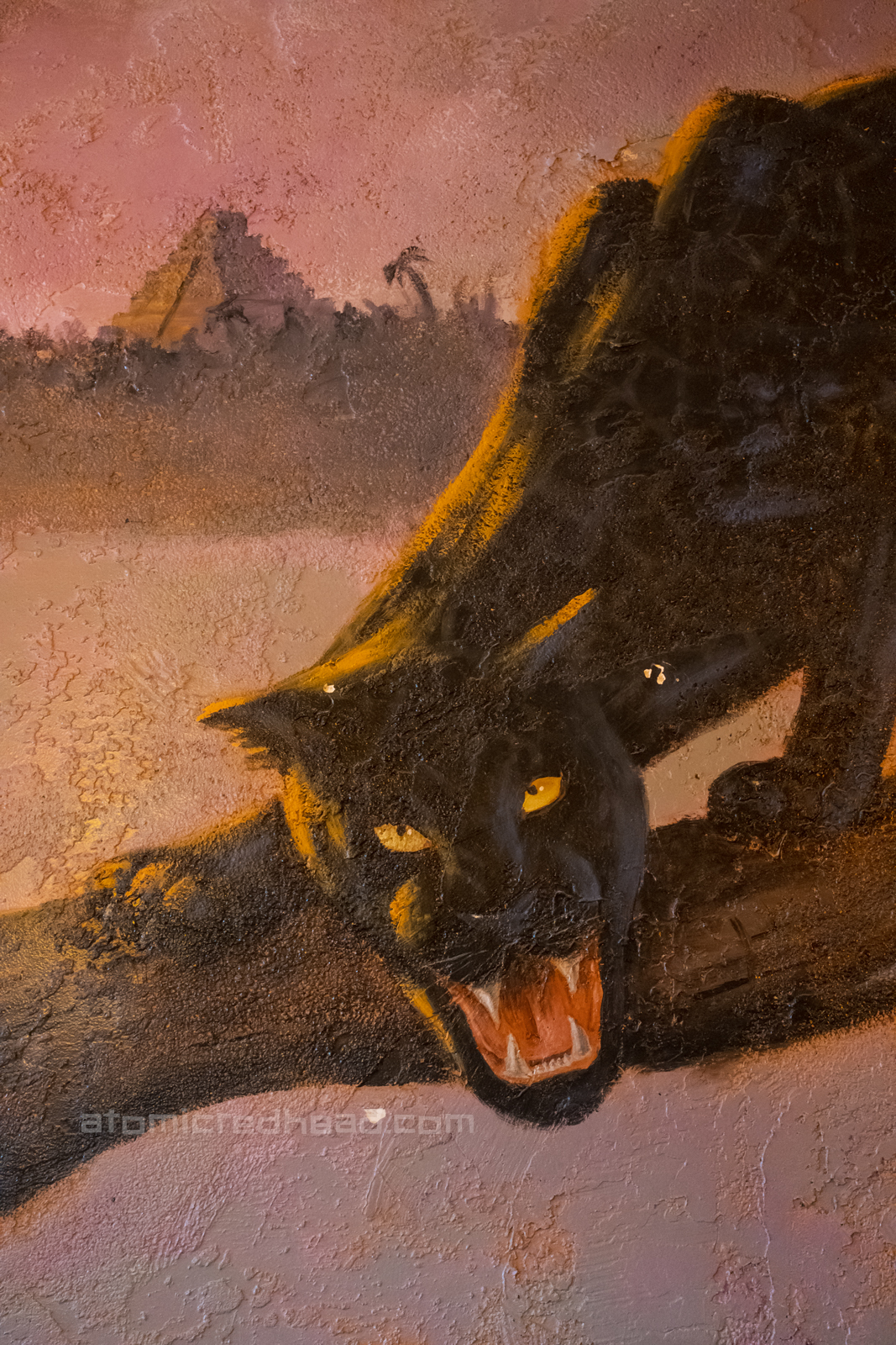 Mural of a black panther painted on the walls of the restaurant.