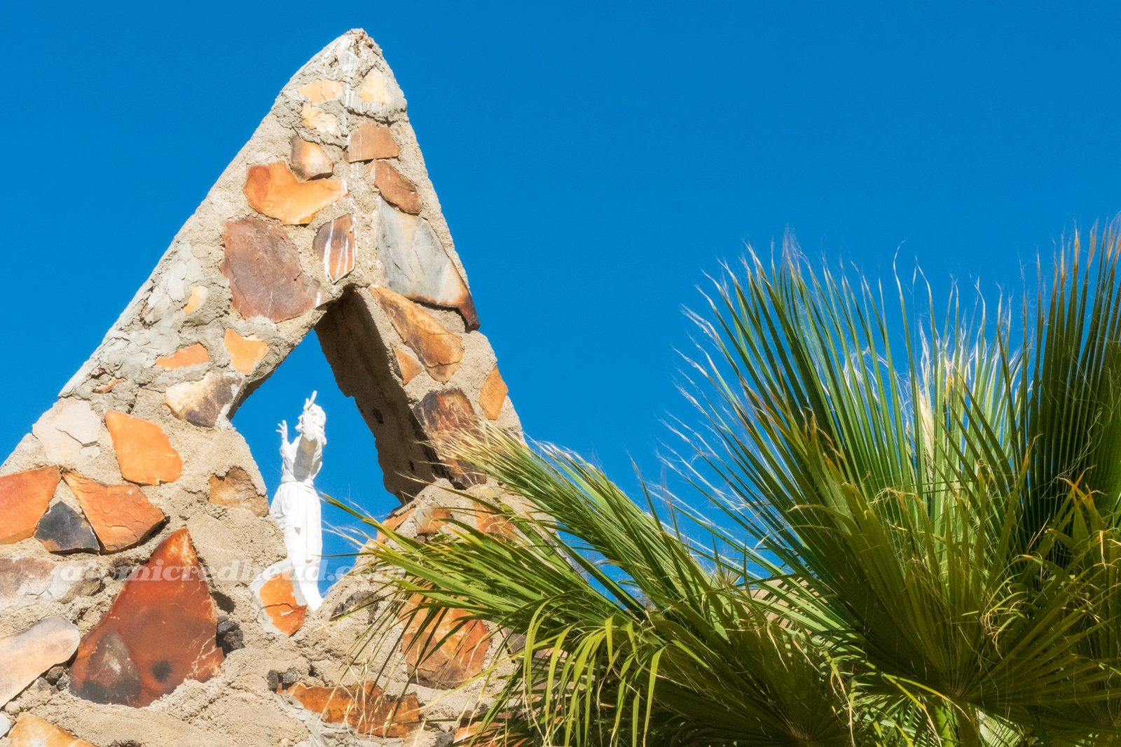 Close-up of the steeple through which the "Unwanted Christ" can be seen.