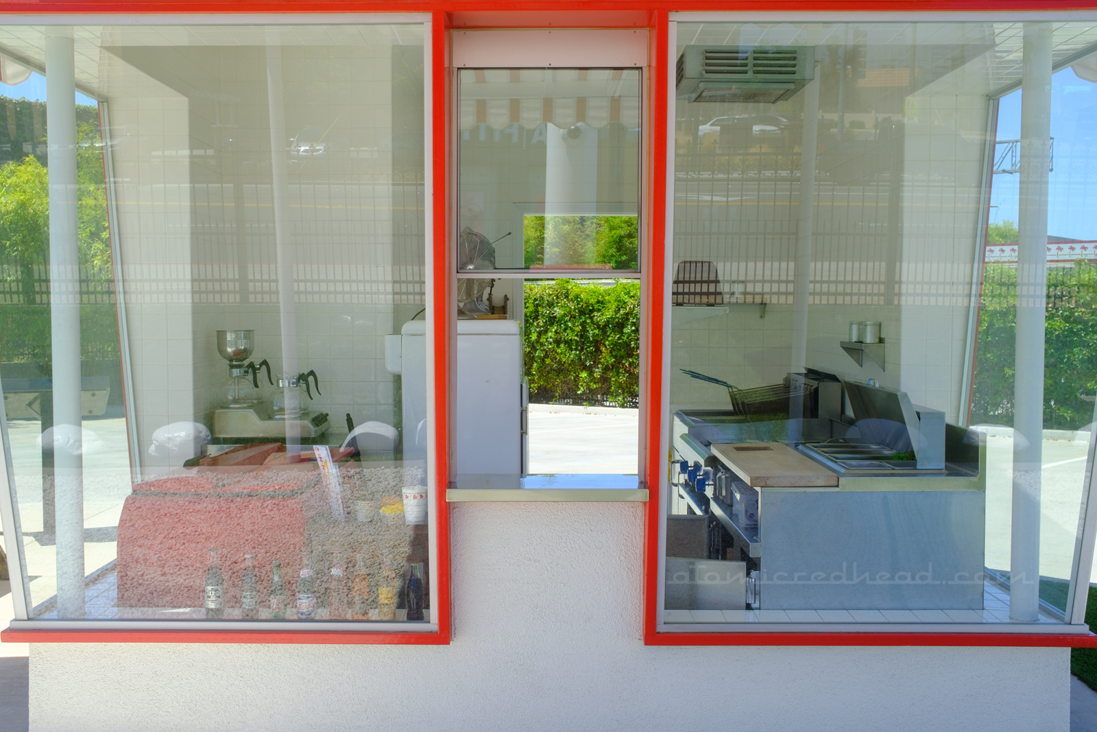 The pick-up window, which allows the customer to see inside the small restaurant.