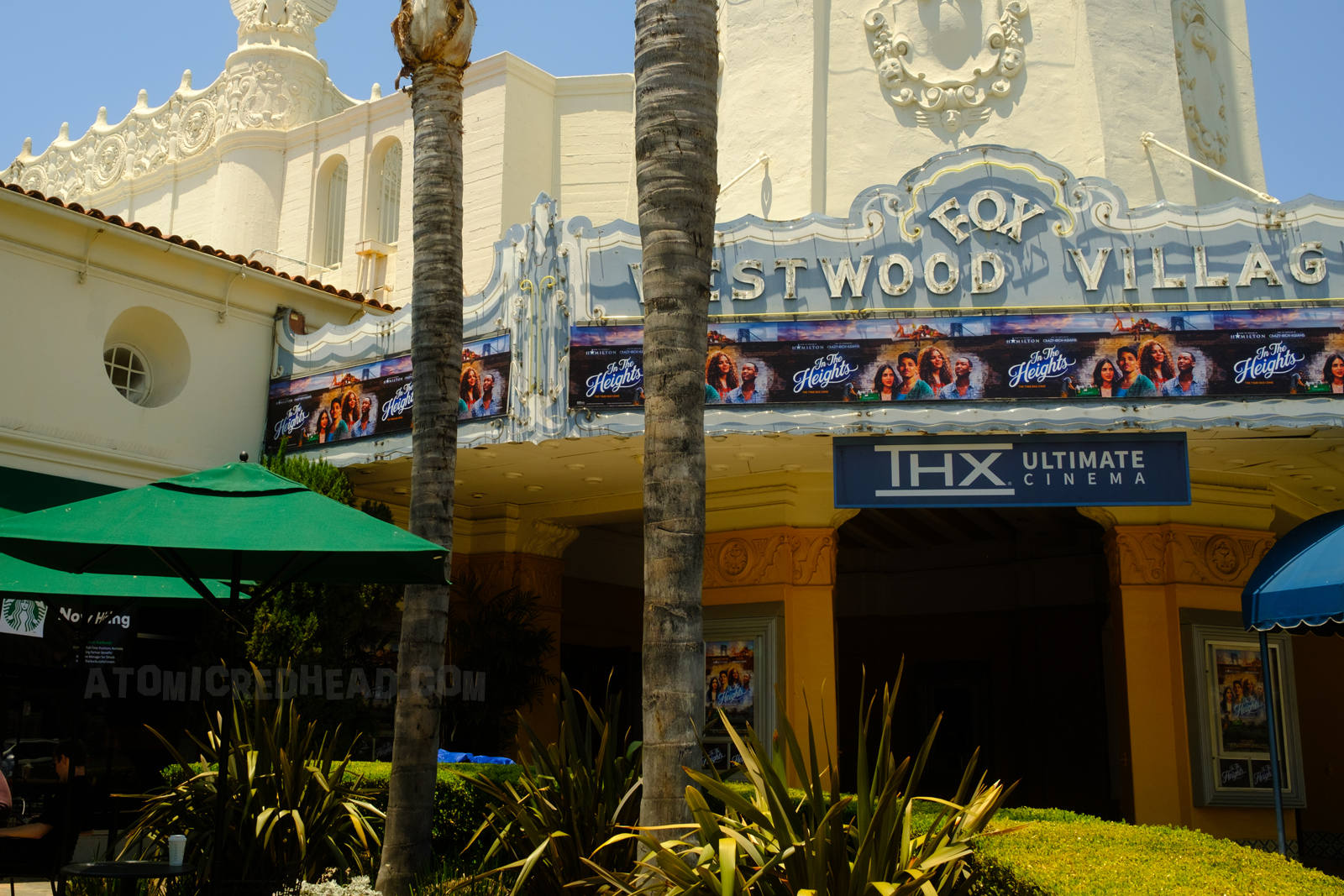 The Fox Westwood Village marquee today, with neon. However, instead of a traditional marquee as seen in the film, it features a banner advertising the showing of In the Heights.