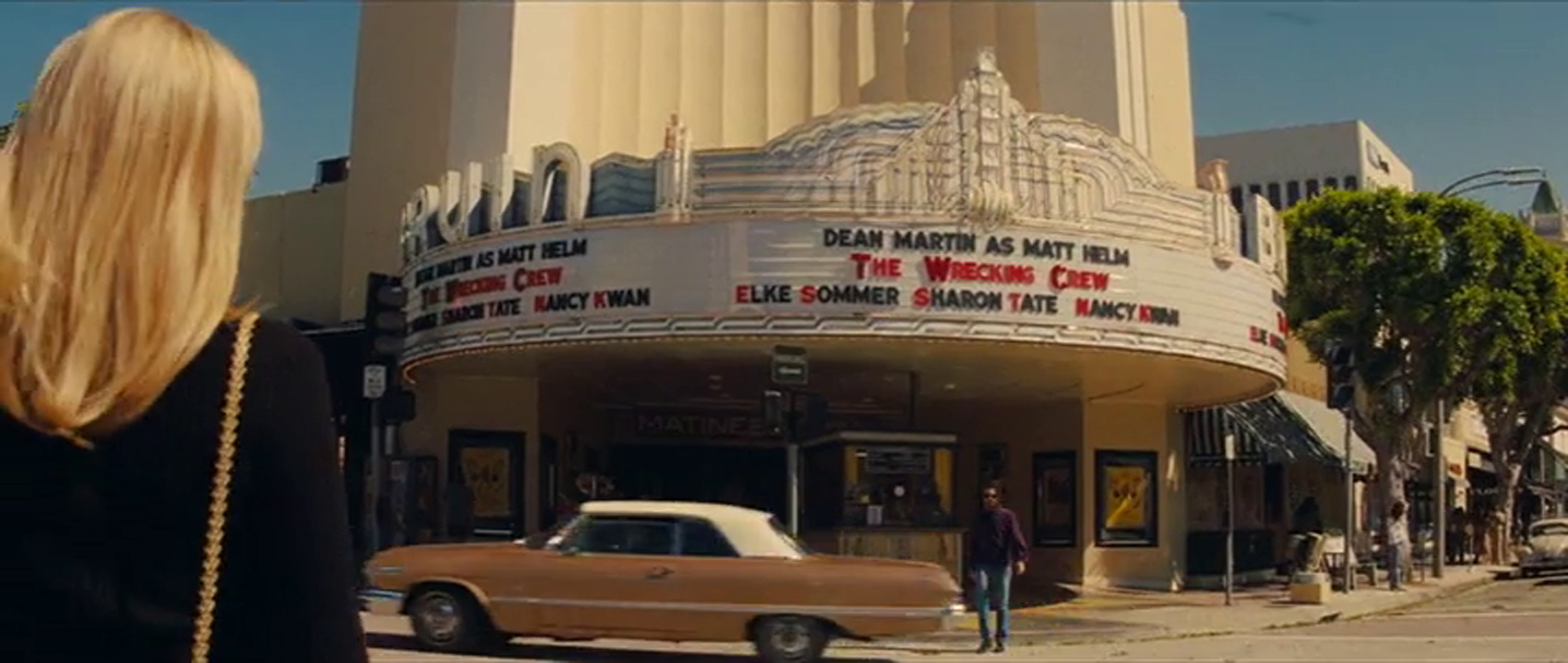 The Bruin as seen in Once Upon a Time...In Hollywood, with neon above its marquee displaying "The Wrecking Crew"