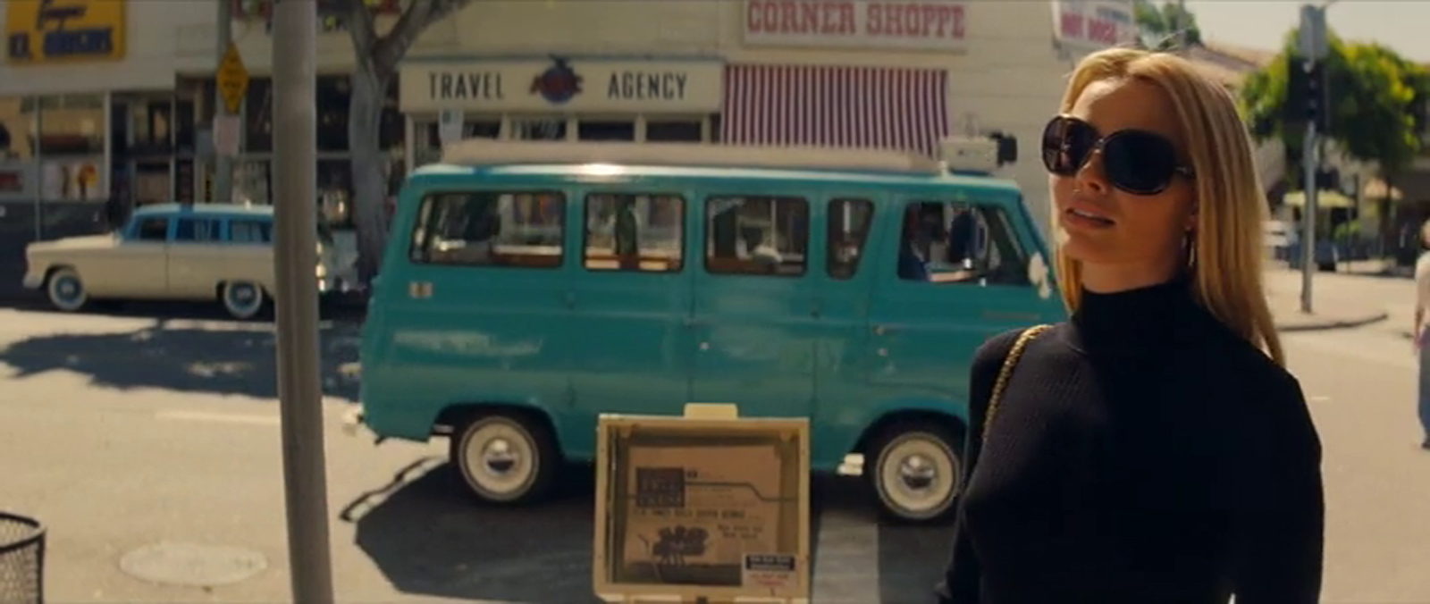 Robbie as Tate looks up at the Bruin.