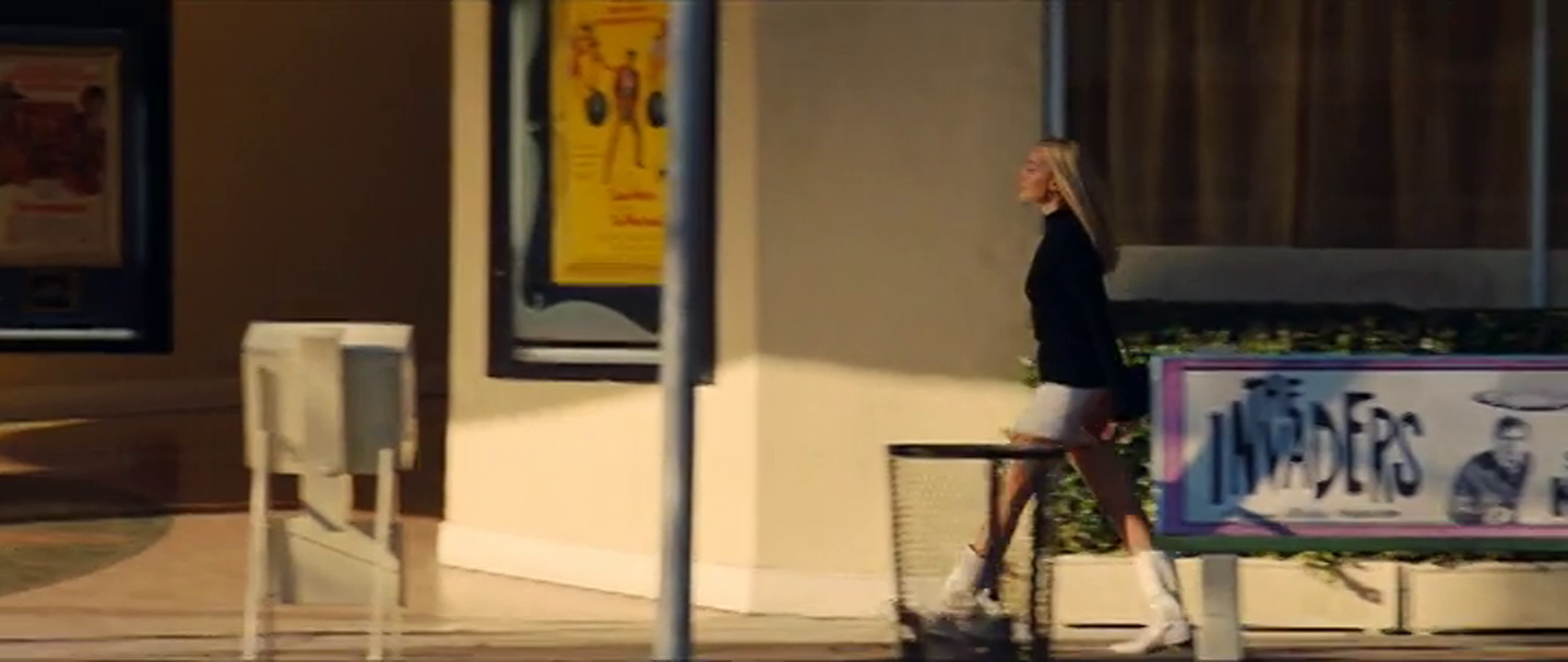 Robbie walks back toward the Bruin, the poster for The Wrecking Crew visible.