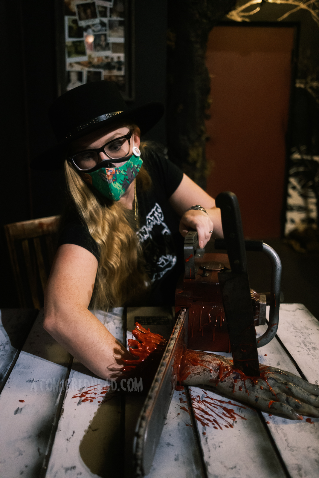 Myself "cutting" off my hand with a chainsaw, recreating a moment from Evil Dead II.