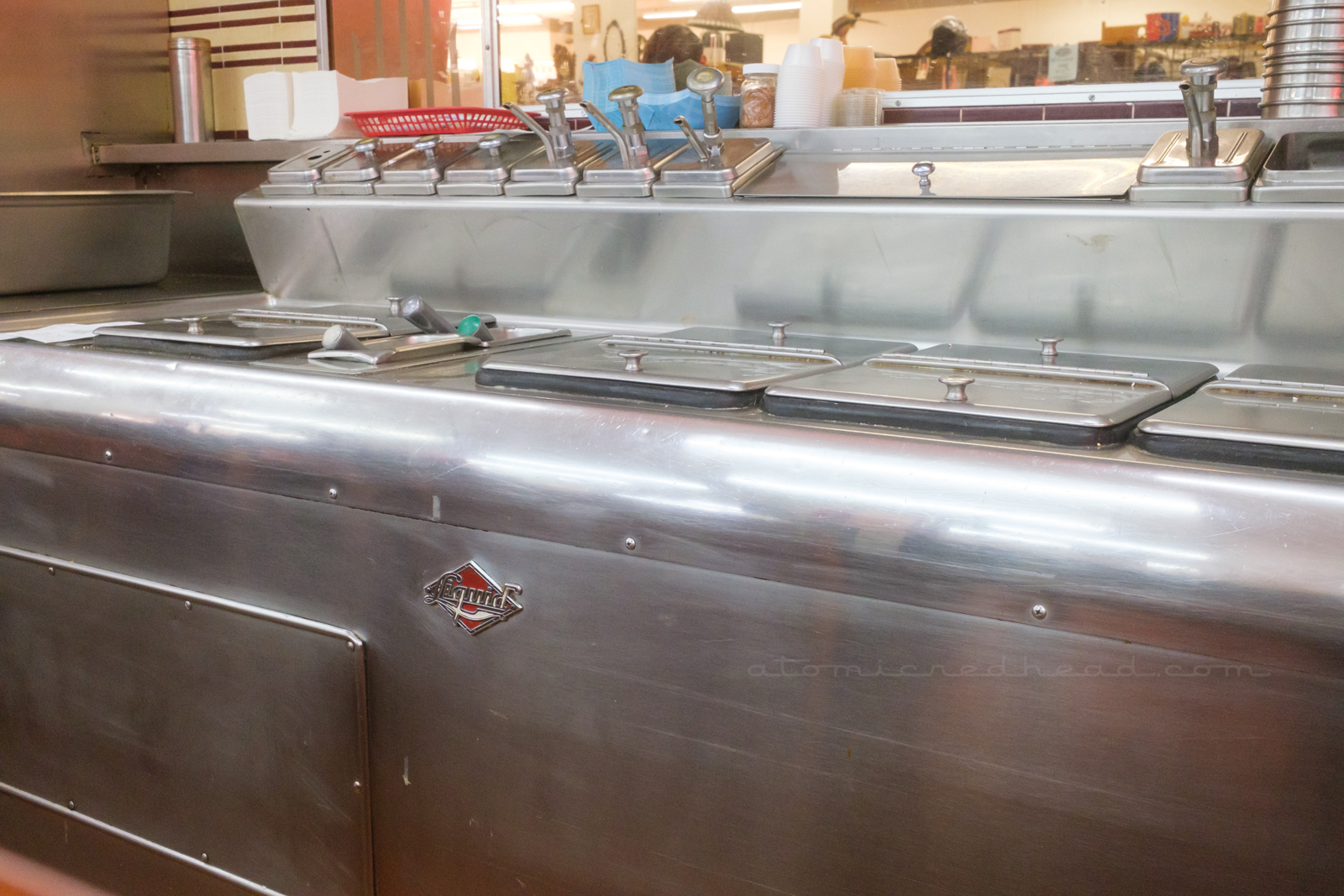 A massive chrome piece of equipment houses the materials for malts and shakes.