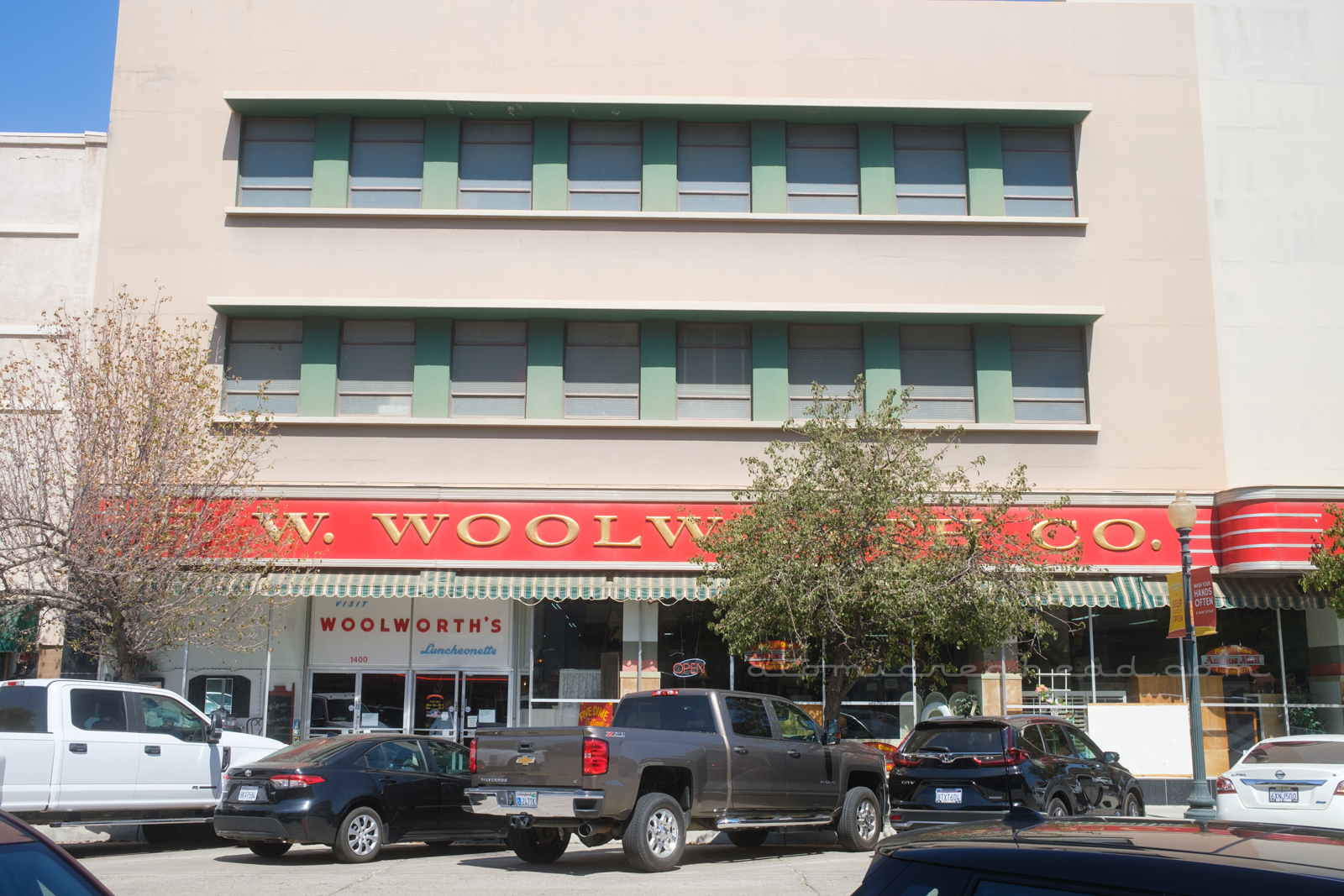 The side of the Woolworth's with the long "F.W. Woolworth's" sign stretching the ling of the photo.