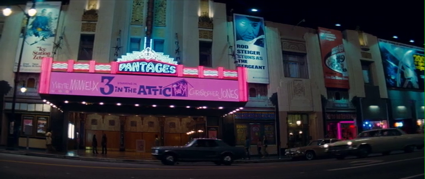 The Pantages as it appears in Once Upon a Time...In Hollywood, with the marquee lit up for 3 in the Attic.