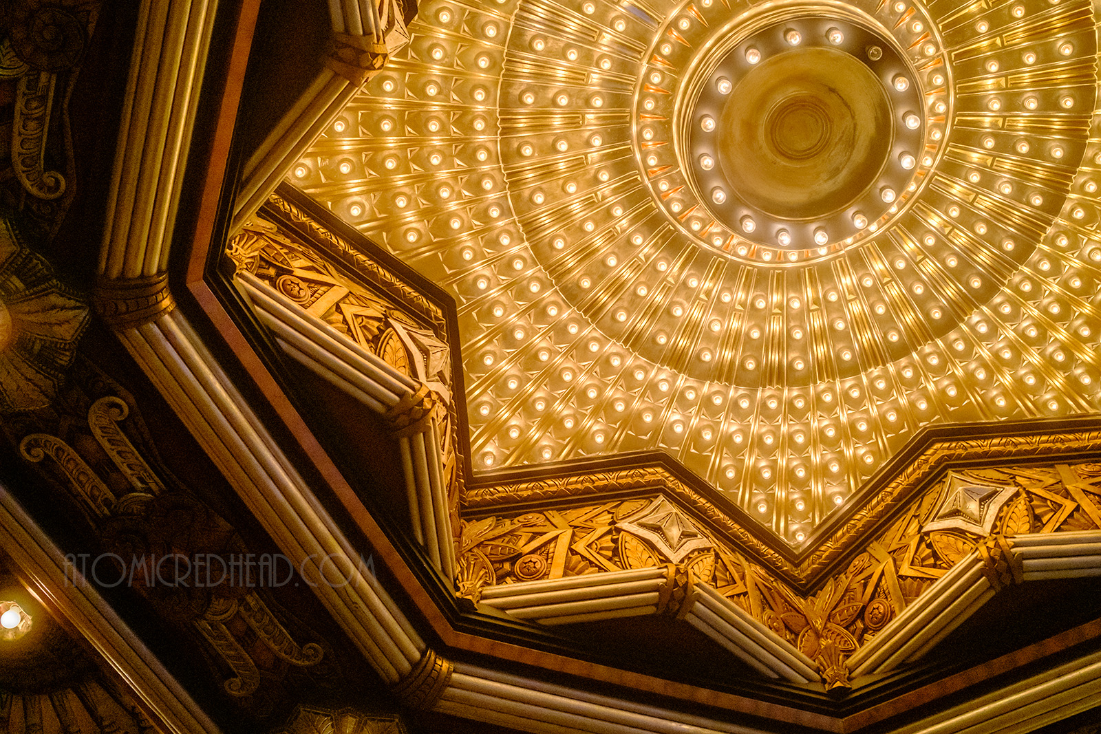 A massive pointed star like shape sits above the exterior doors and features many bulbs to flood the outside. 