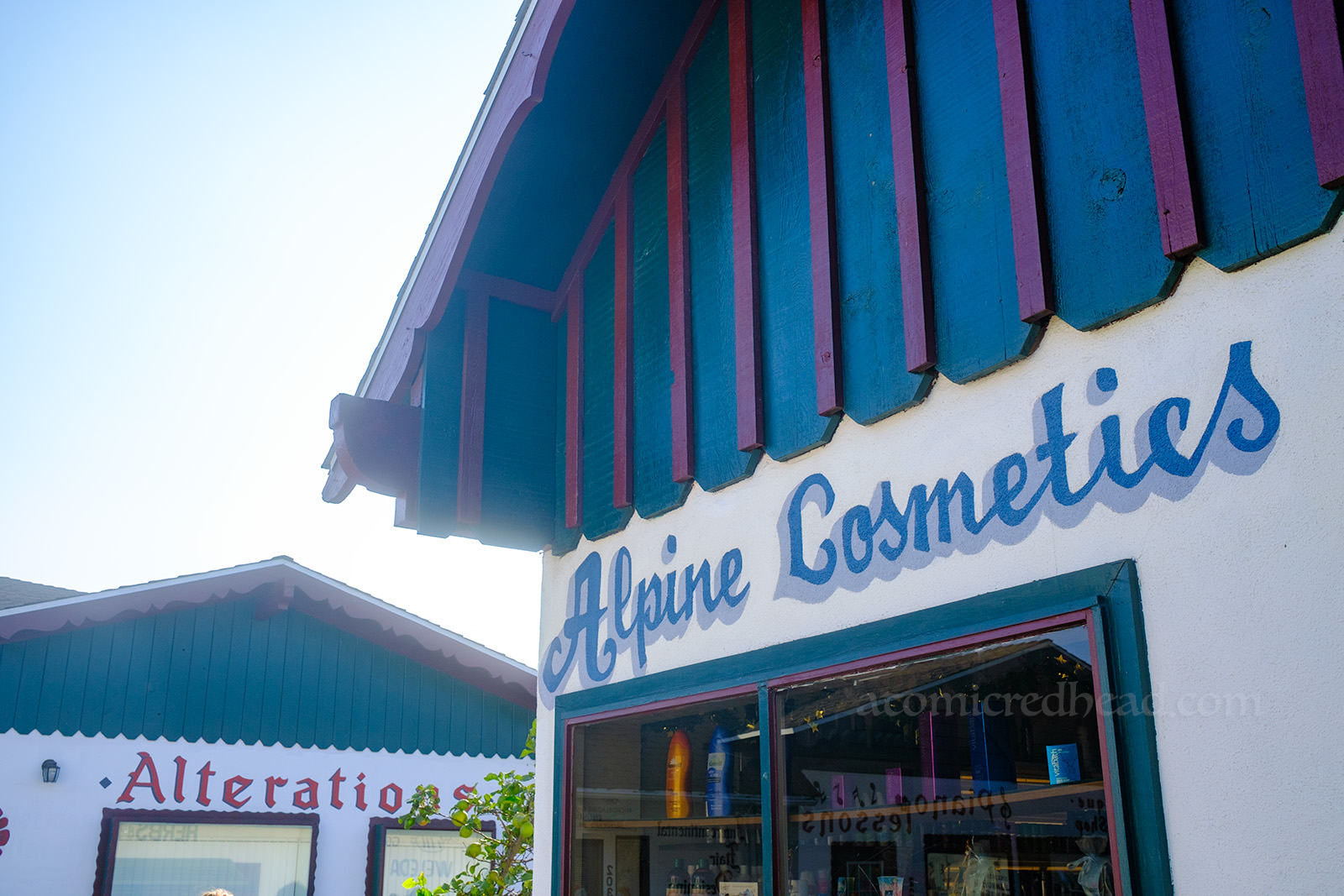 Hand painted script reads "Alpine Cosmetics"