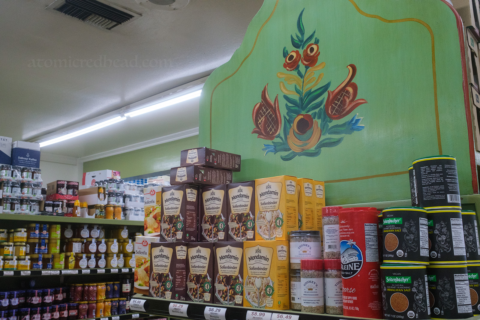 Store displays inside the market feature hand painted floral details, as seen in this end cap.