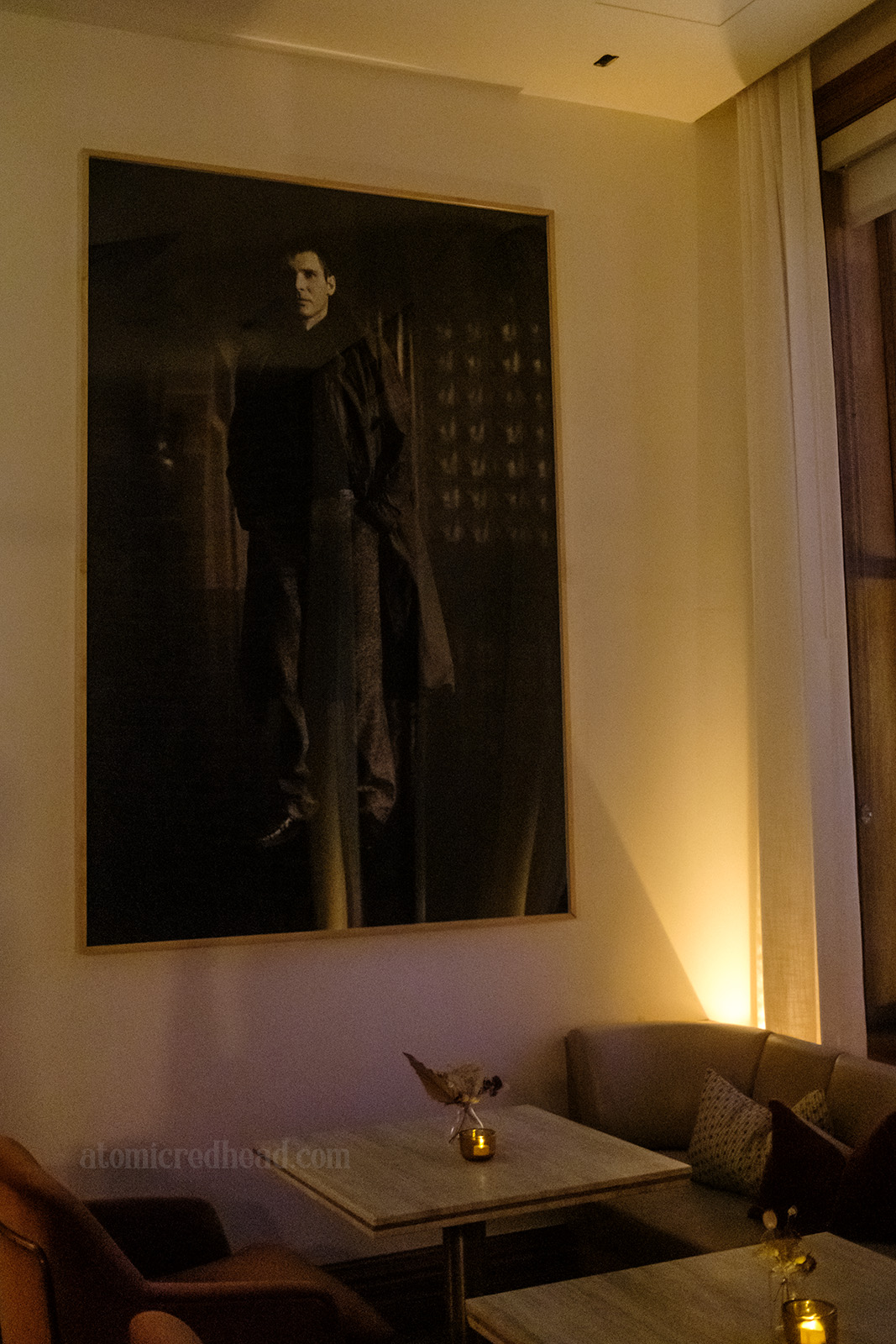 A massive black and white photograph of Harrison Ford in his Blade Runner costume.