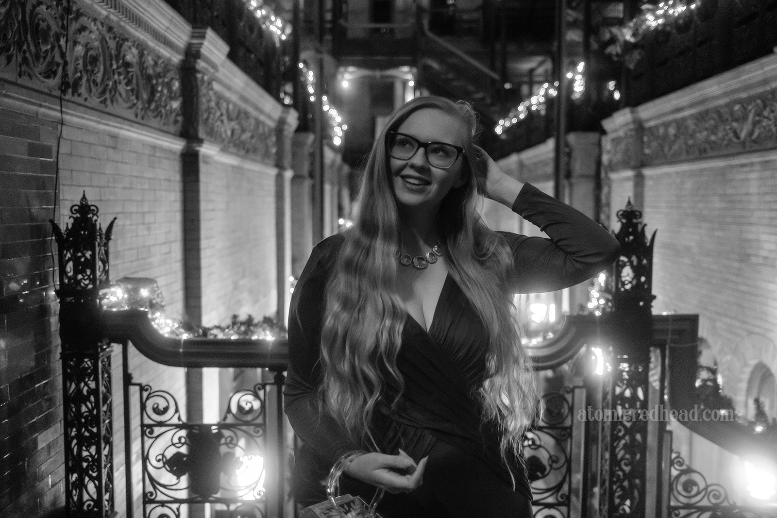 Black and white photo of myself standing on the staircase.