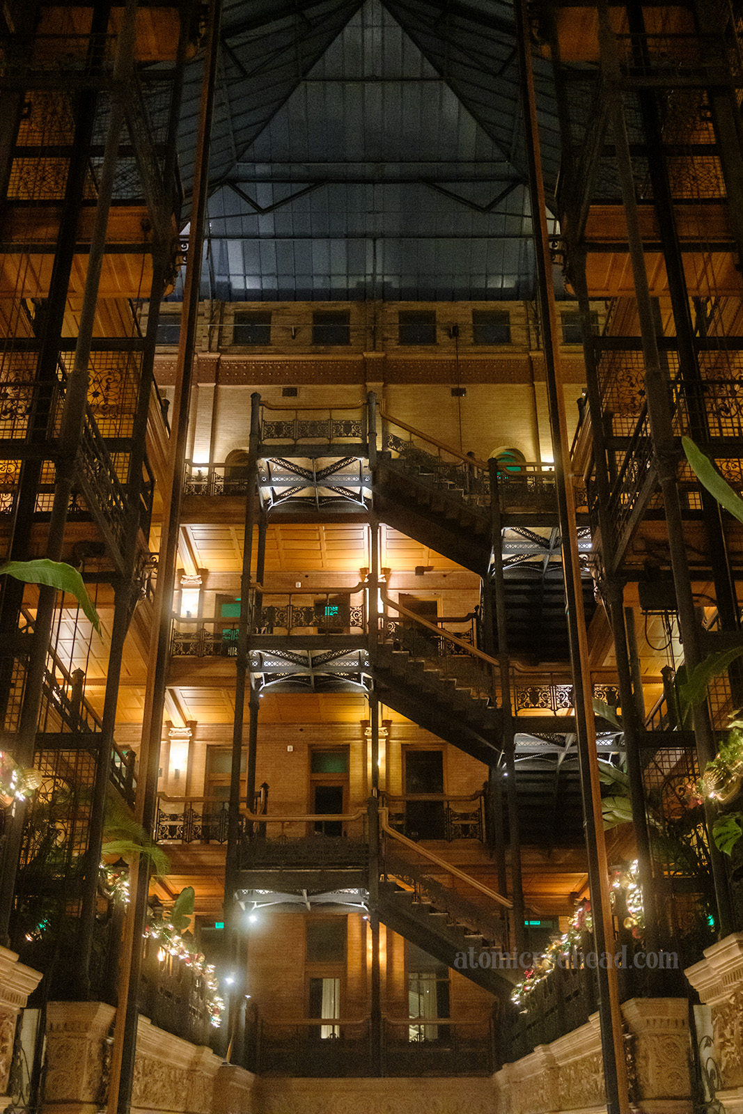 View of the staircase as it winds its way up toward the skylight.