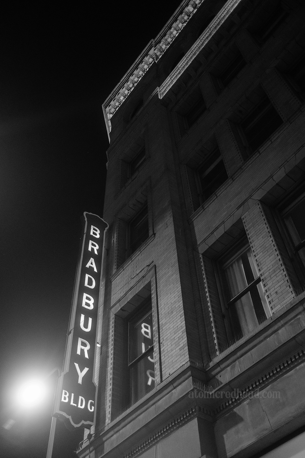 Exterior of the Bradbury, with a blade style sign reading "Bradbury."