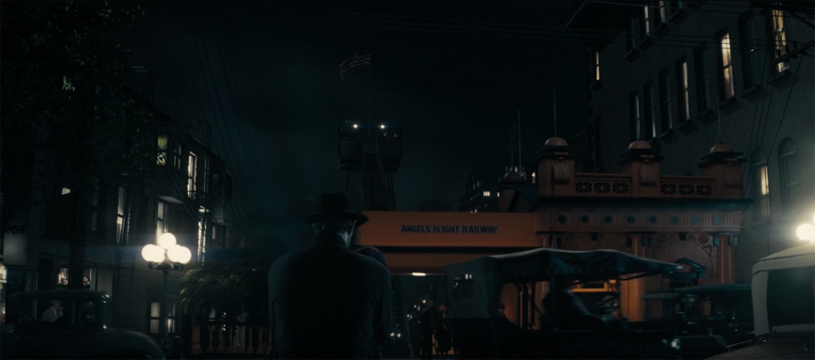 Screencap from Perry Mason, the Gran Avenue station visible at night.