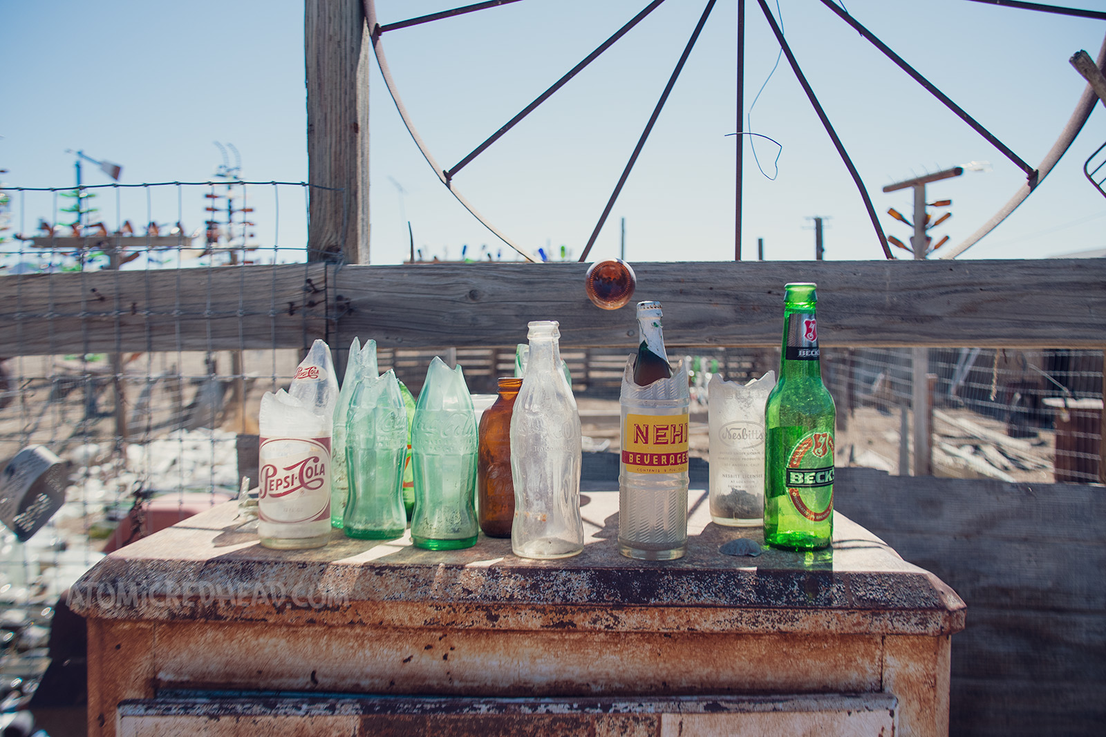 Various bottles sit atop an old ice box.