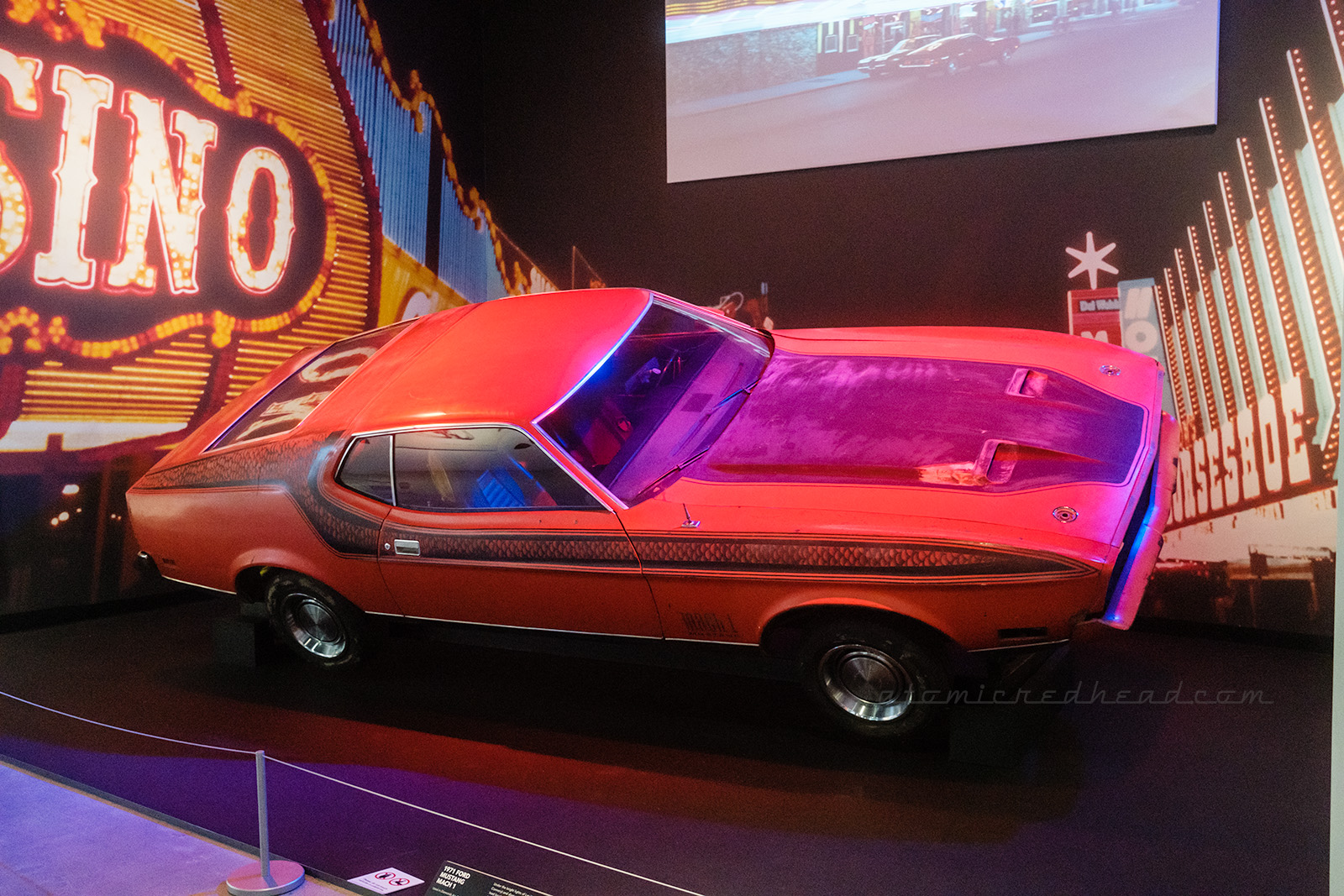 The 1971 Ford Mustang Mac 1, as seen in the chase through Las Vegas in Diamonds are Forever. While all red in the film, it later received some black details on the hood and along the side.