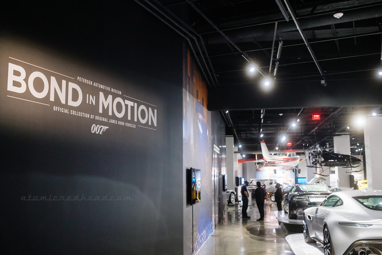 Overall view of the James Bond display, with large text on the wall reading "Bond in Motion"