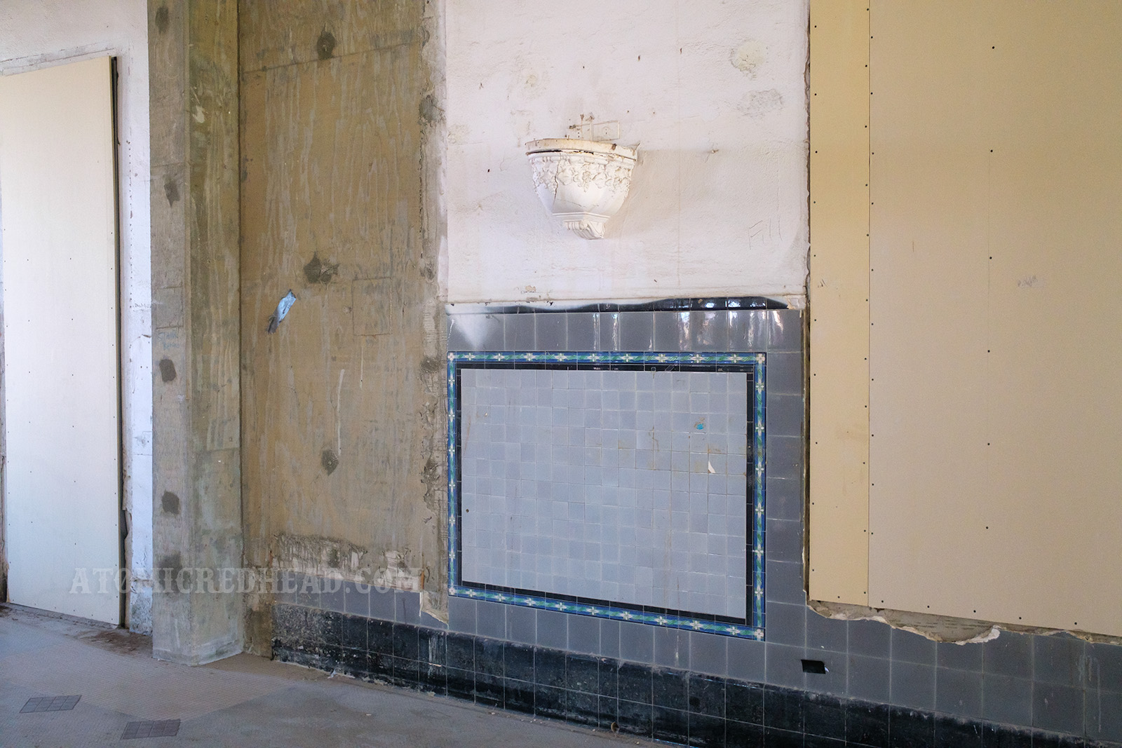 A portion of the tile remains on a wall of the old lunch counter.