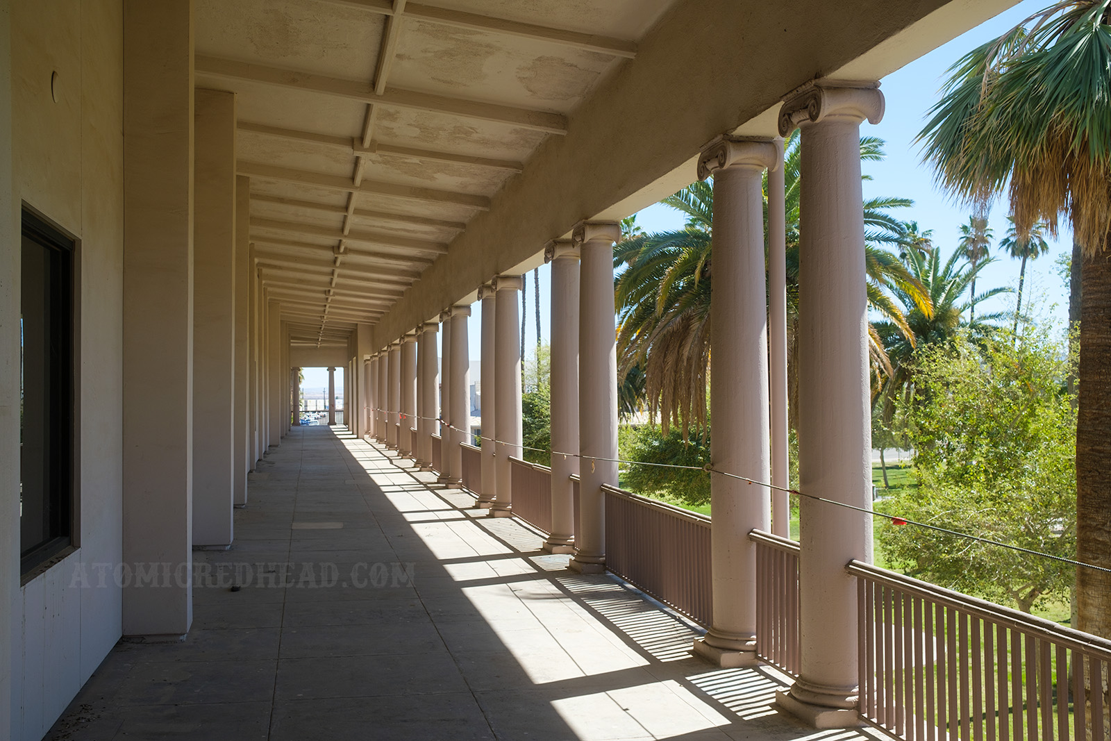 Looking down the long pillared balcony of the second story of the El Garces.