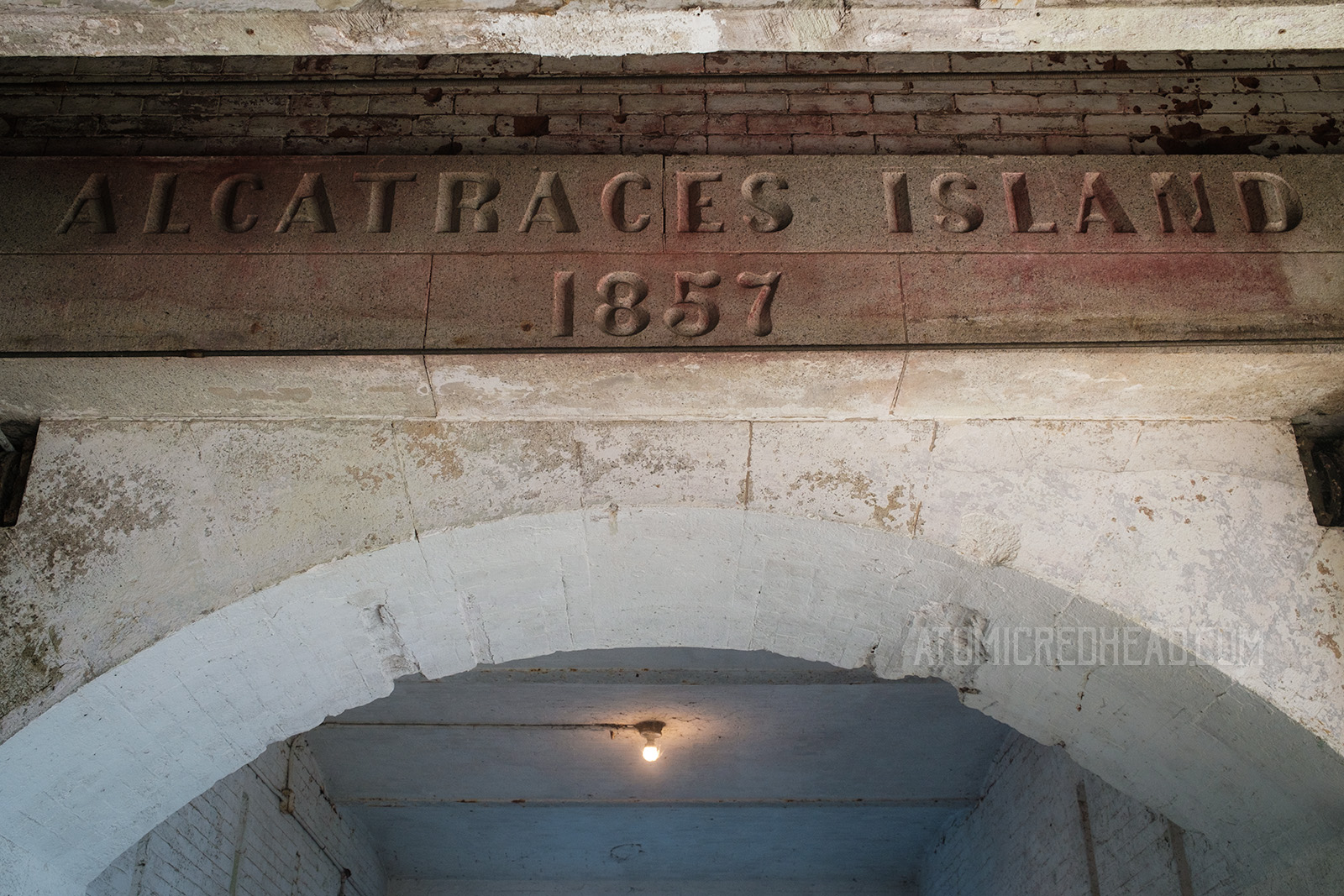 Etched into stone above an archway reads "Alcatraces Island 1857"