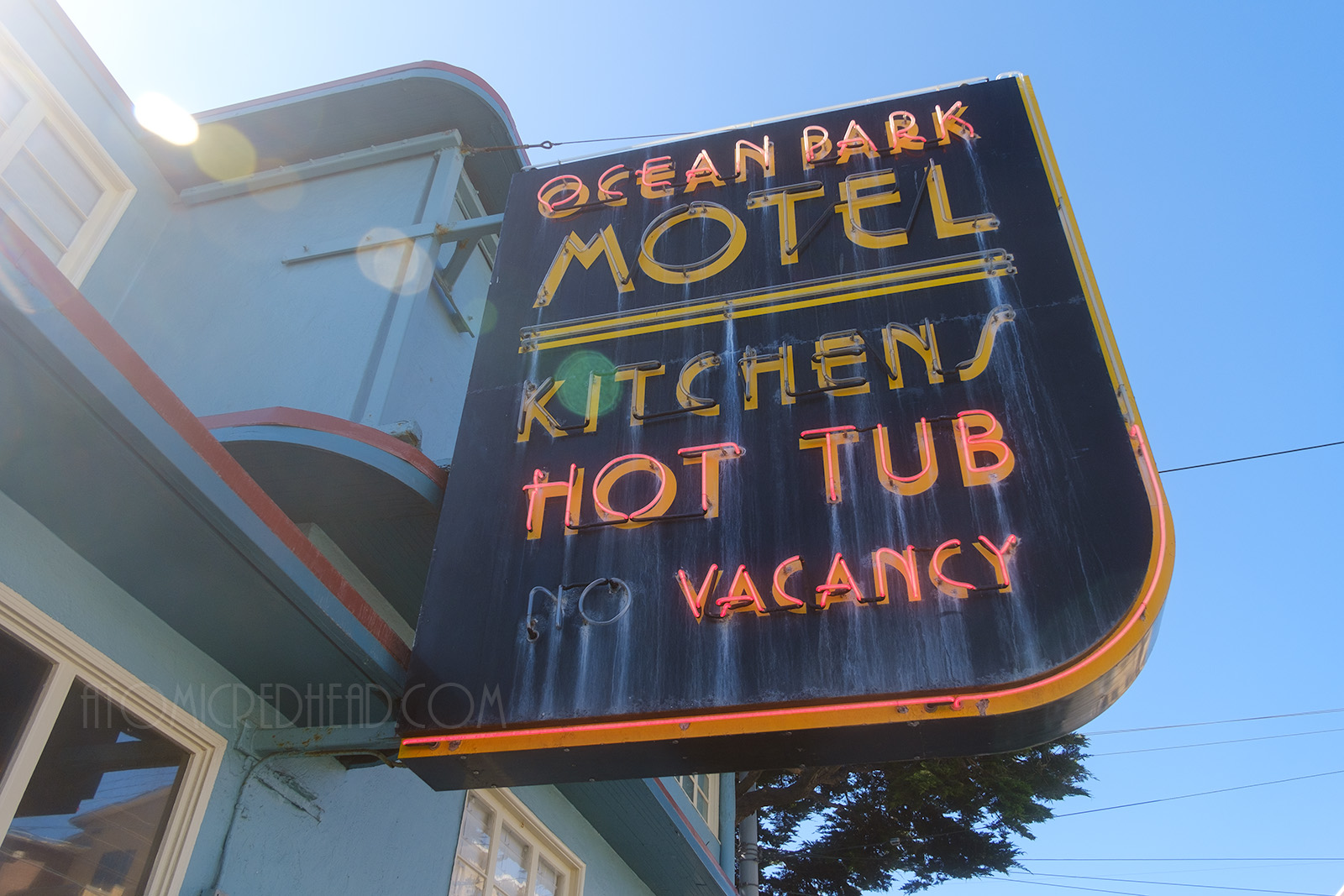 Close-up of the sign which reads "Ocean Park Motel Kitchens Hot Tub No Vacancy" in neon.