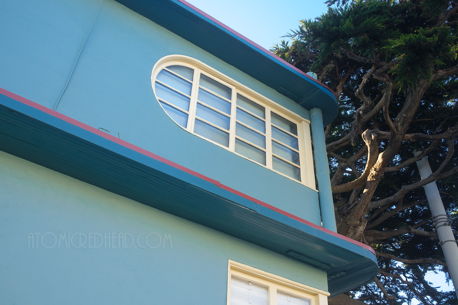 Close-up of a corner window, which features on curved side.